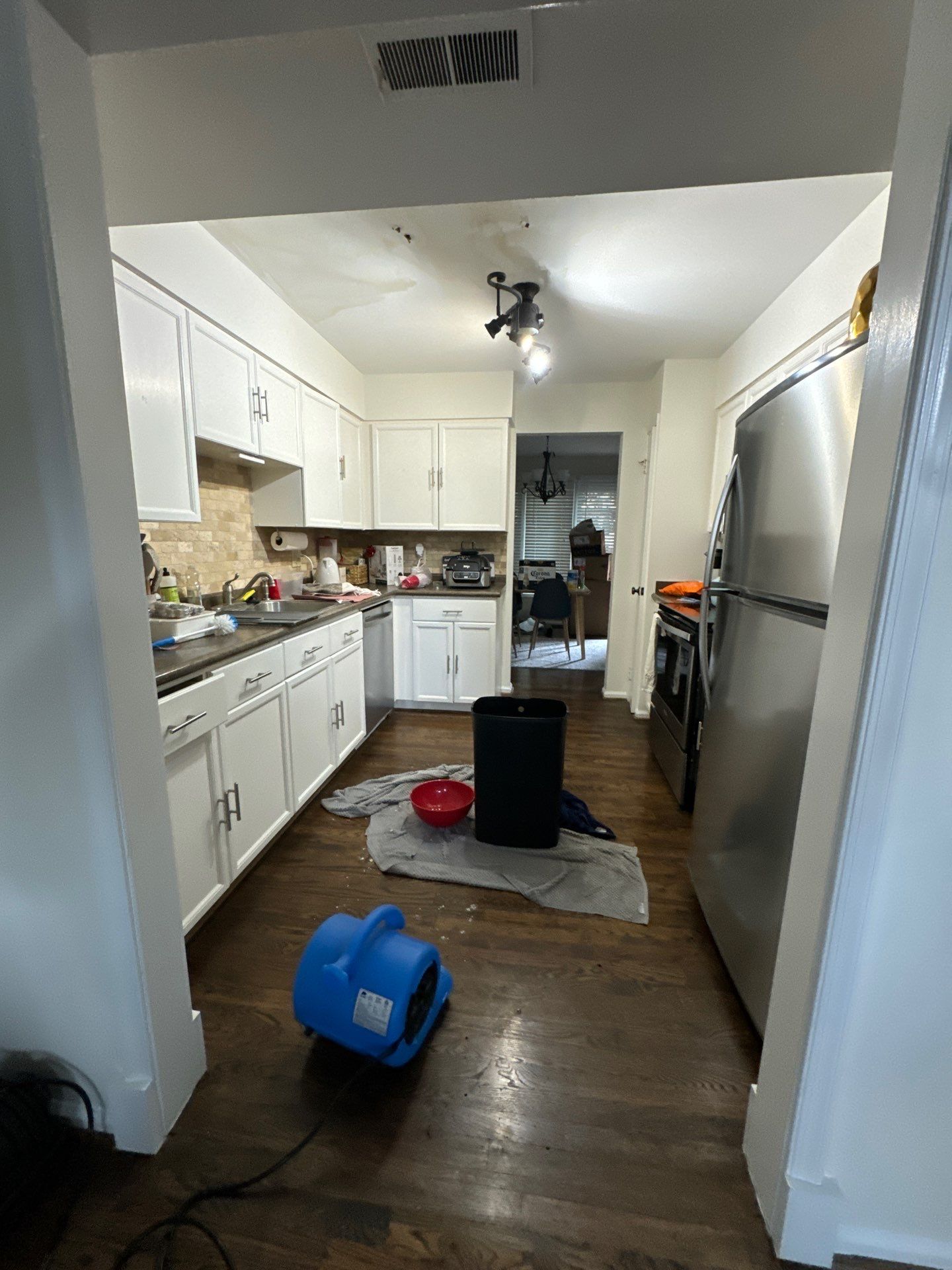 Ceiling damage assessment and preparation for repair following water damage restoration.