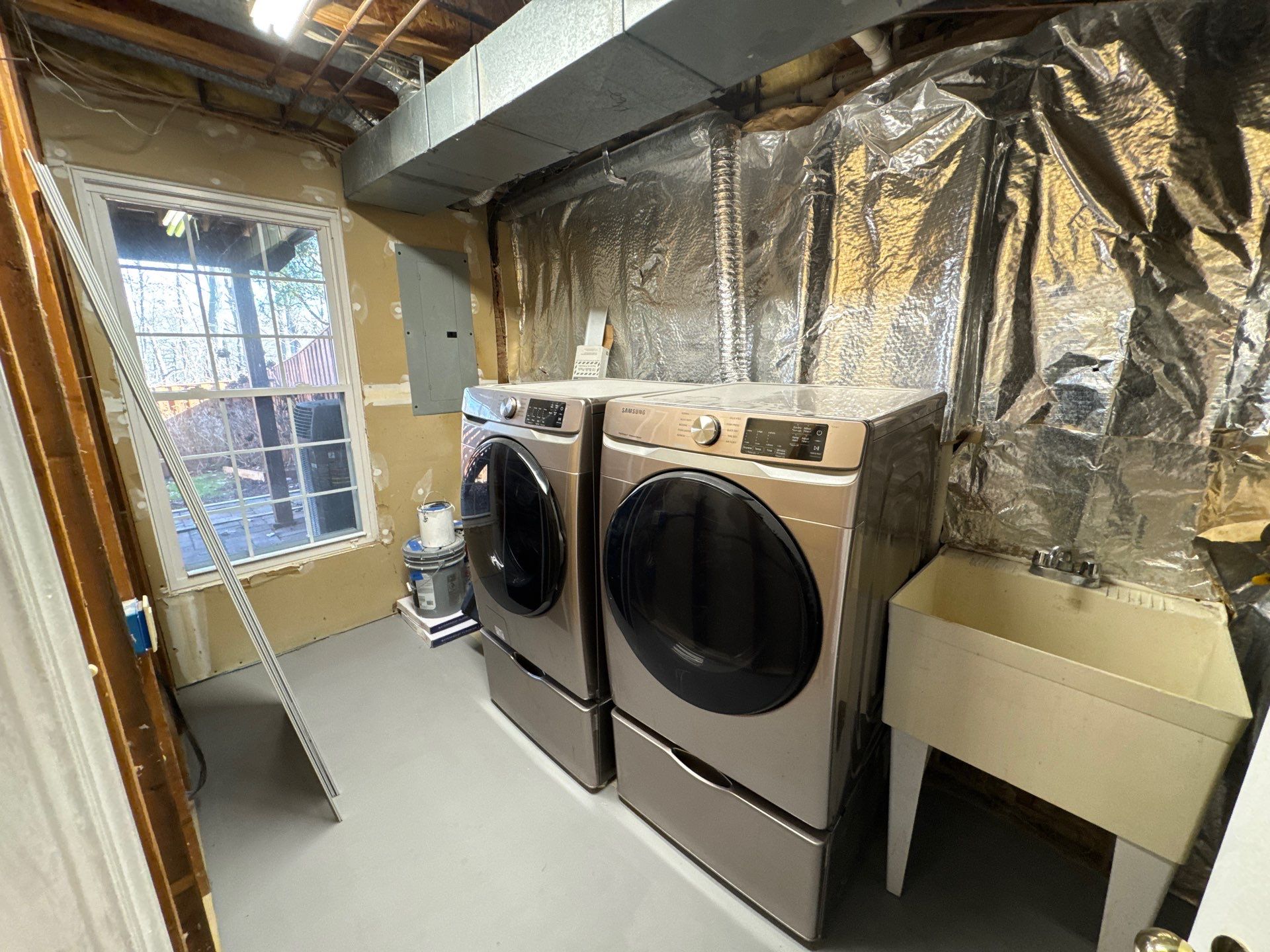 Containment barrier and negative air setup isolating affected ceiling area during water damage remediation.