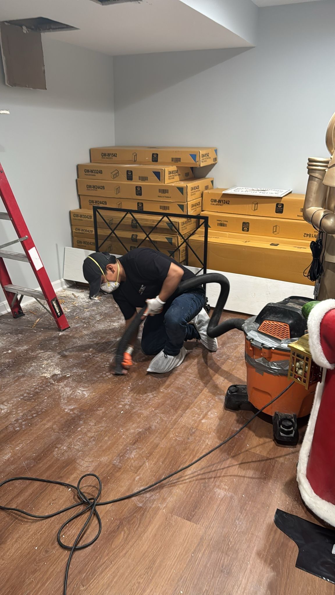 Sanitizing application in progress across treated surfaces during final stages of water restoration work.