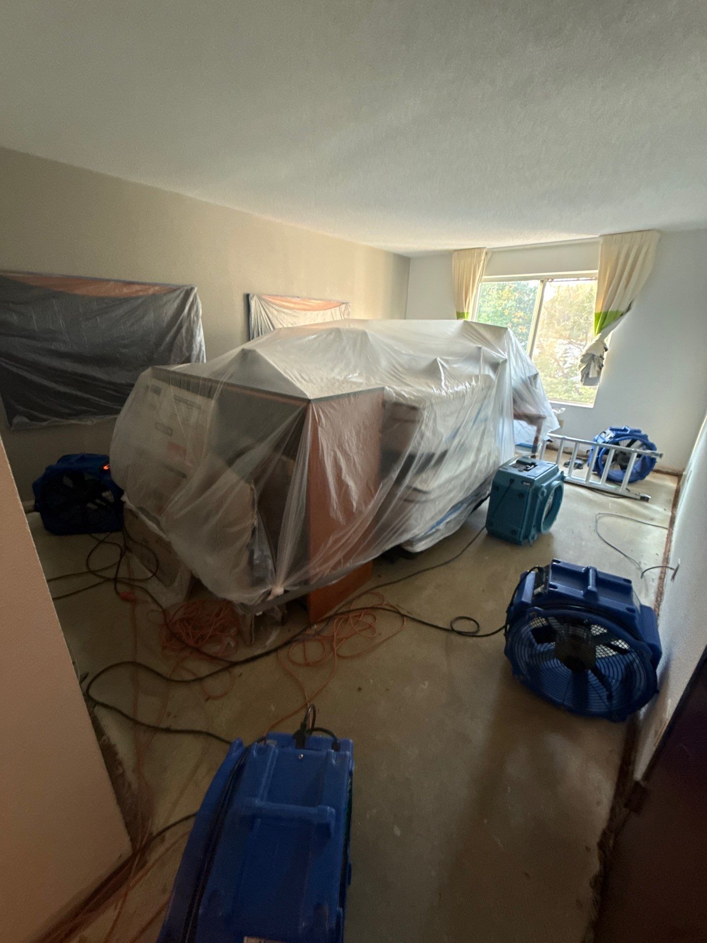Structural drying equipment positioned to remove residual moisture and prevent mold colonization during remediation.