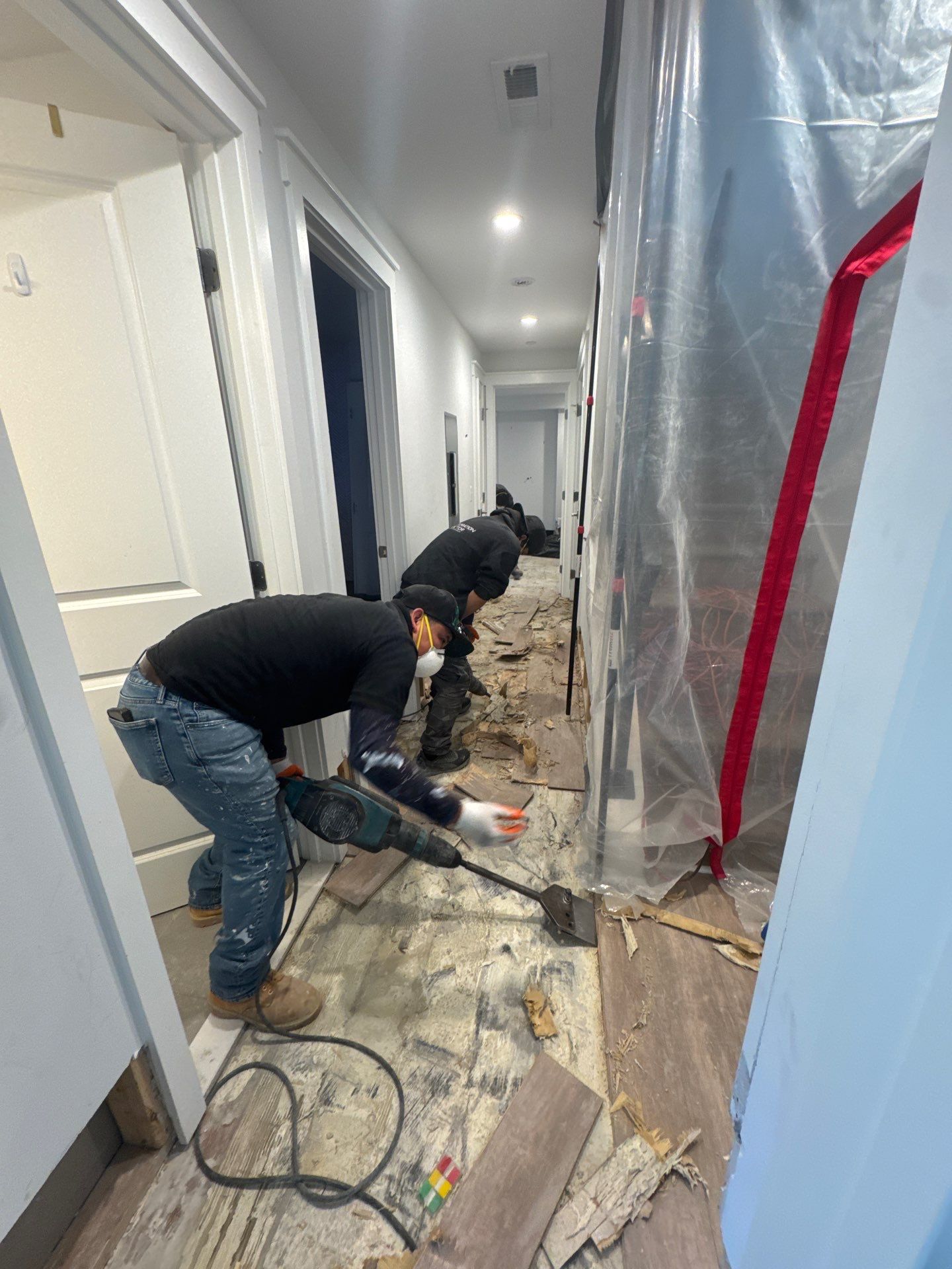 Baseboard replacement underway following mold removal and structural drying in this Fairfax job.