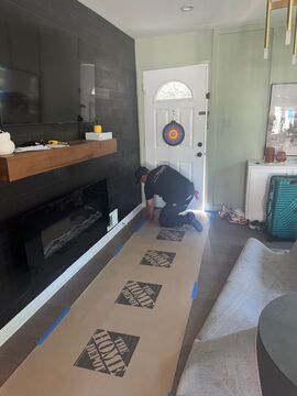 Mid-stage drying setup showing dehumidifiers and air movers working through affected areas during water restoration.