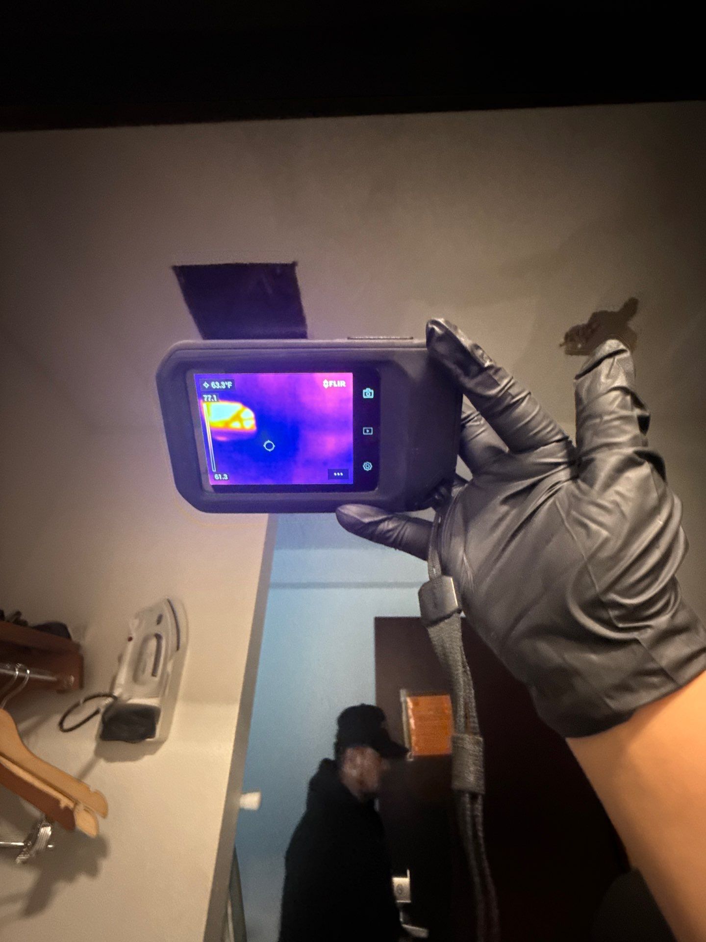 Thermal imaging identifies moisture patterns within structural cavities during drying phase.