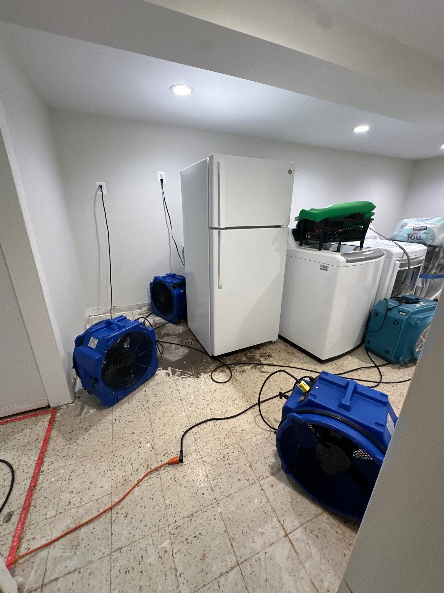 Continued drying and moisture management during water restoration, equipment monitoring in progress.