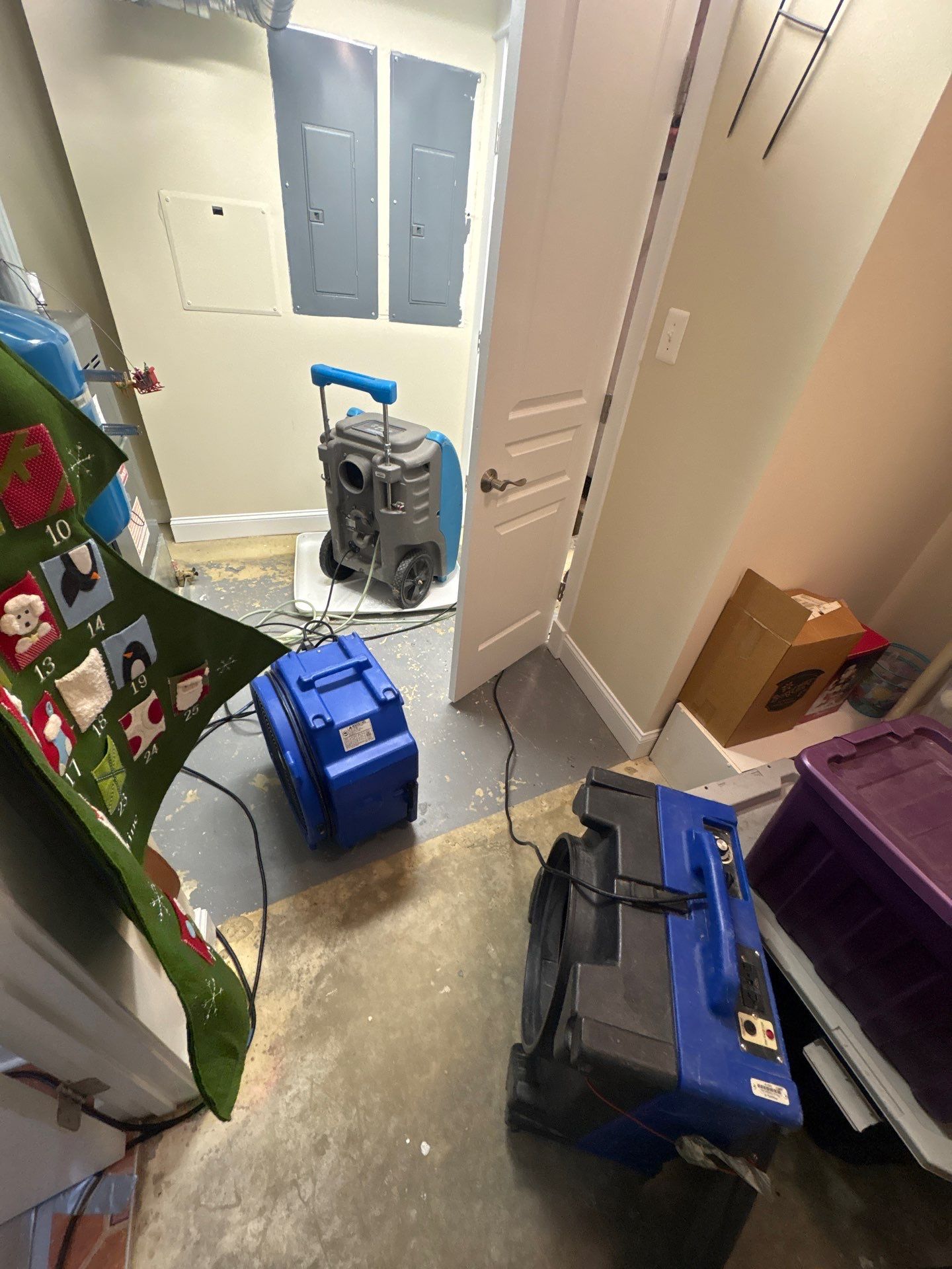 Wall cavity inspection during Arlington water damage restoration to assess structural drying progress.