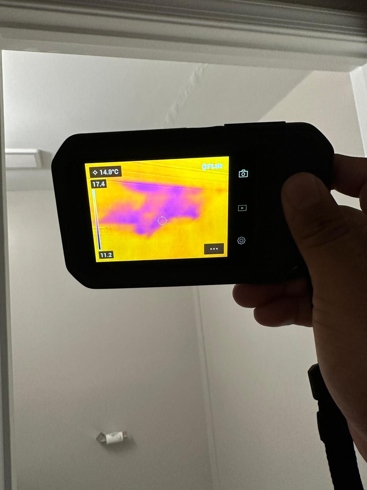 Dehumidifier positioned in affected room to extract moisture during structural drying phase.