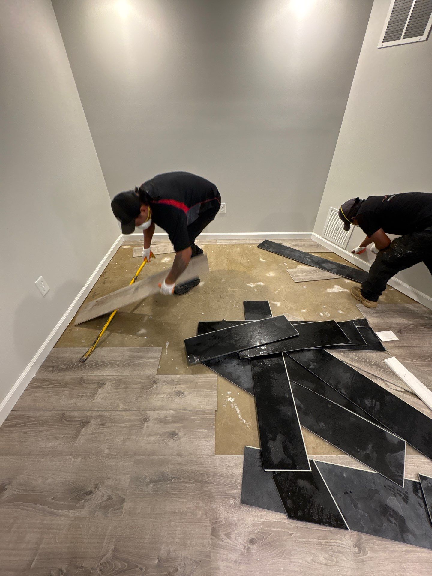 Containment and protected contents staged during active water damage mitigation work.