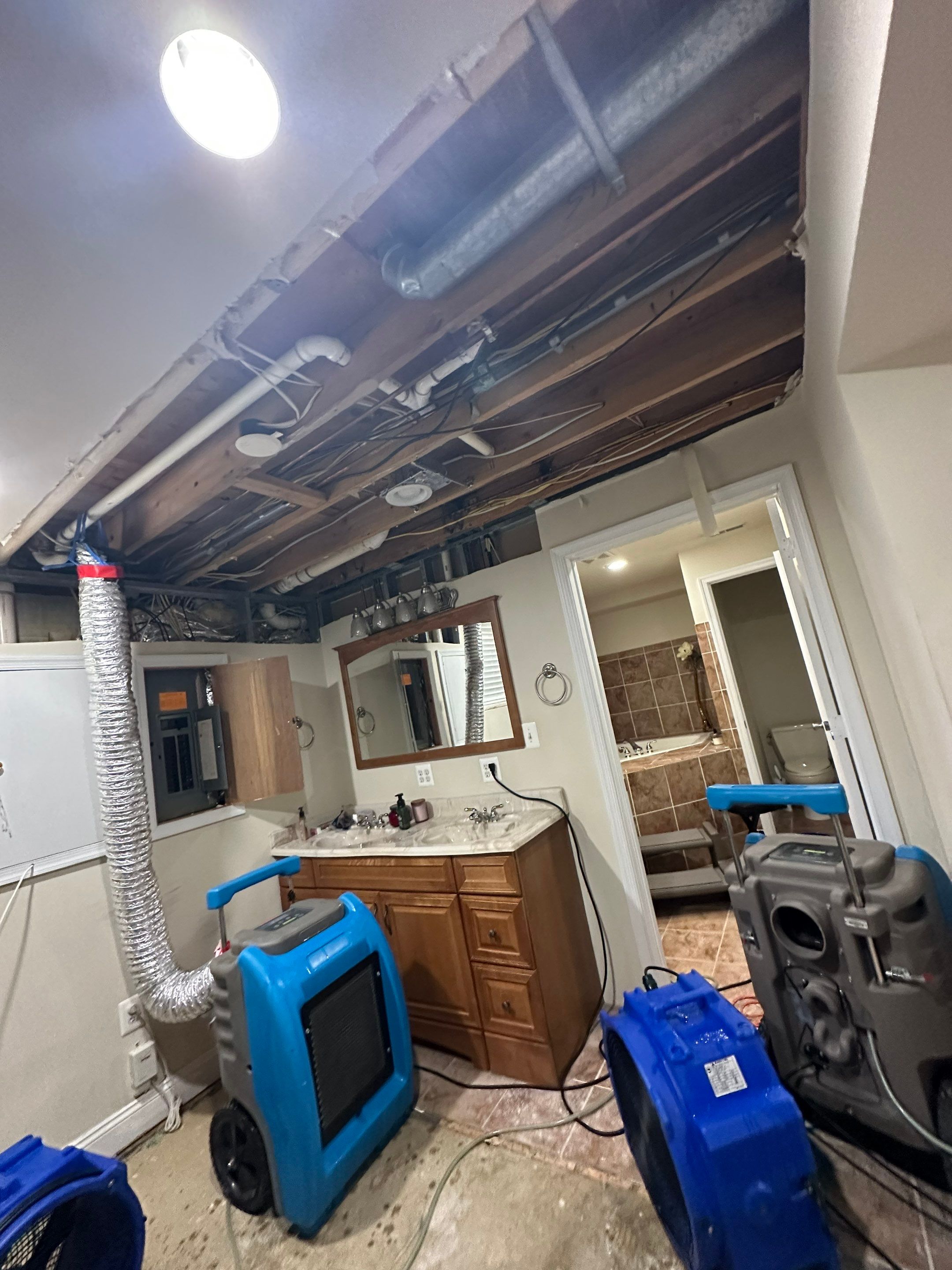 Completed ceiling repair and structural restoration following water damage remediation in Montclair.