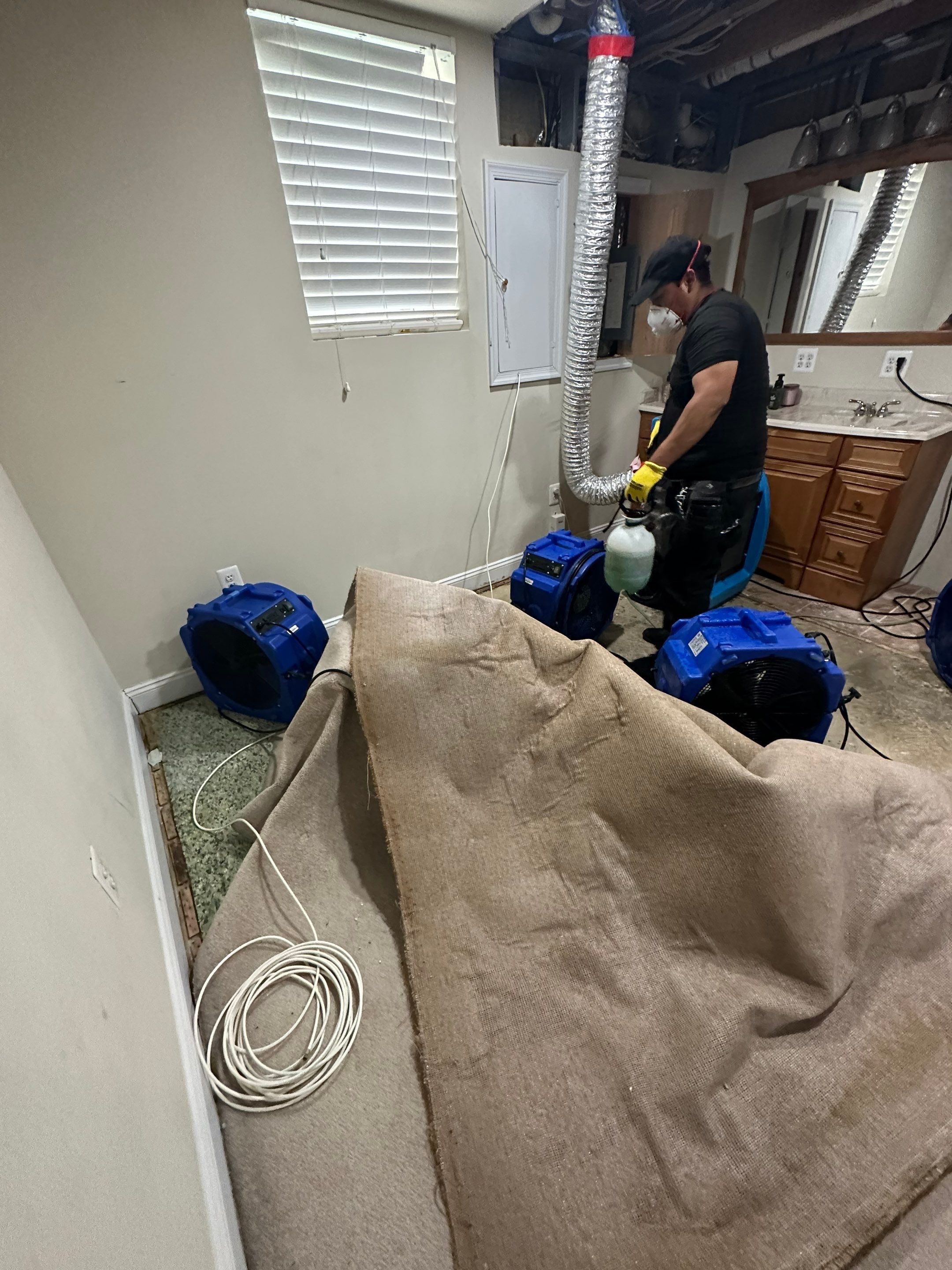 Mid-stage drying phase with continued dehumidification and air circulation to remove residual moisture.