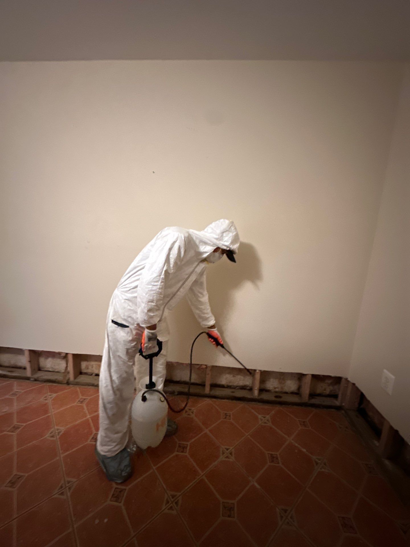 Standing water extraction underway within containment during Arlington mold remediation work.