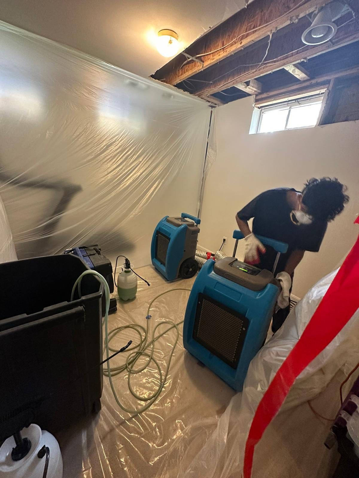 Dehumidification equipment monitoring moisture levels as structural drying continues in the restoration.