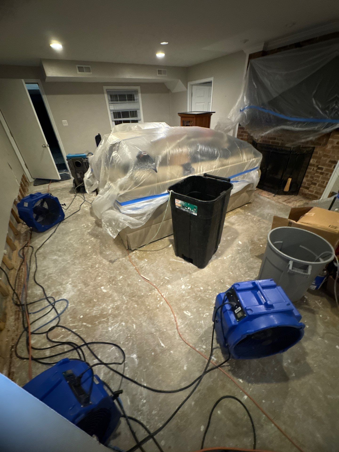 Contents protected and staged during active water extraction and drying operations.