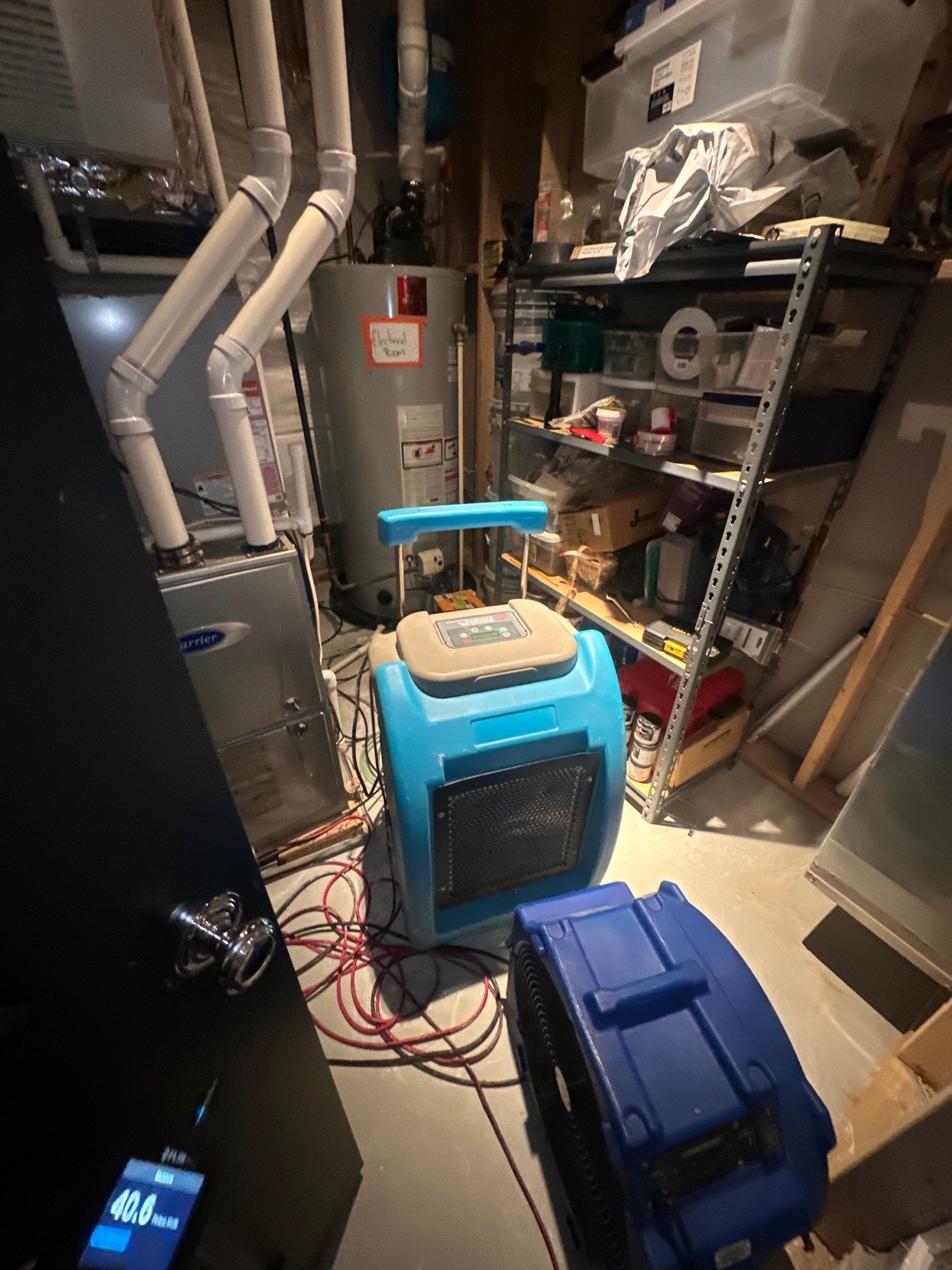 Dehumidification and air circulation setup for moisture removal in Arlington restoration work.