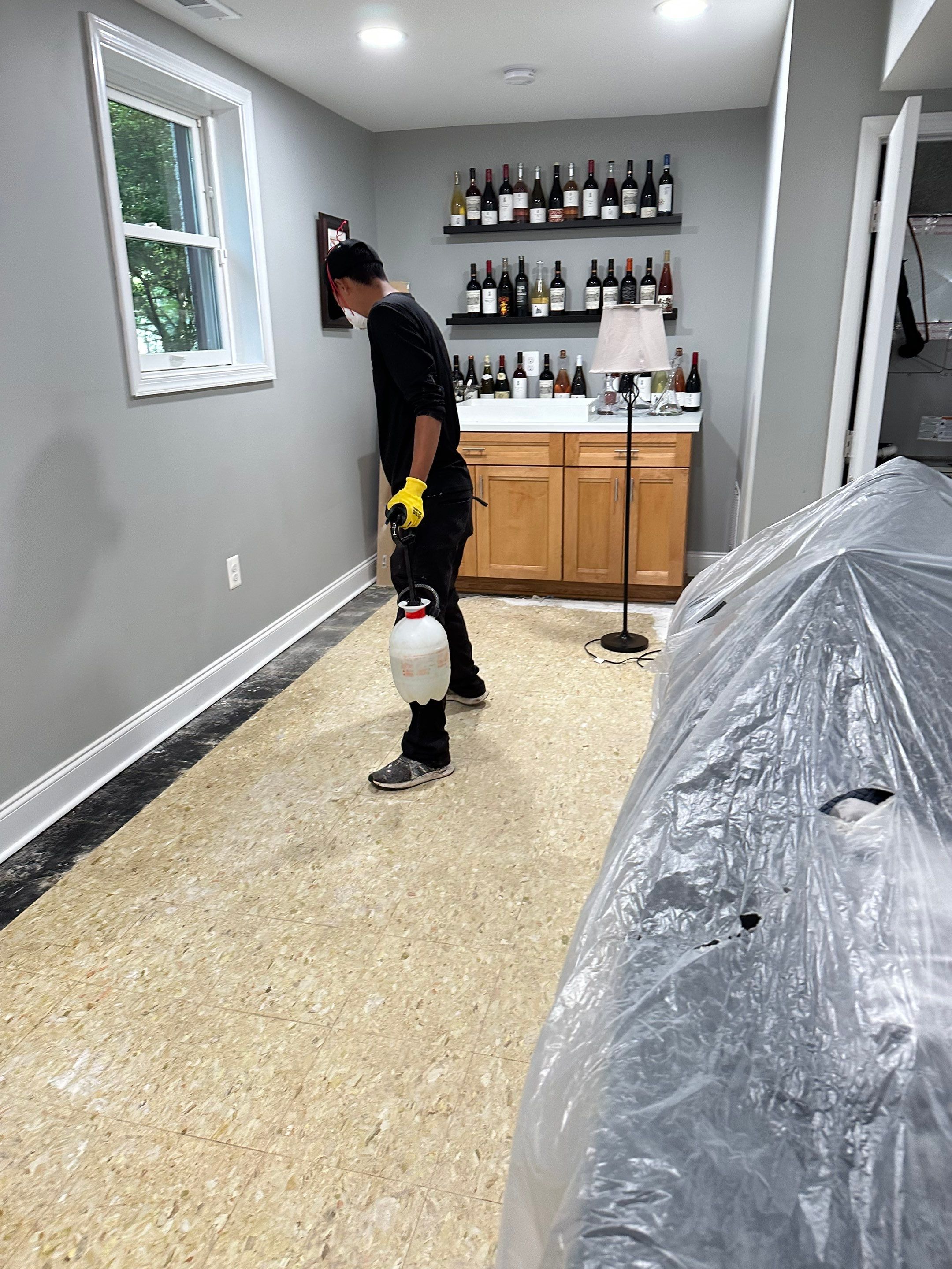 Water-damaged carpet and flooring in Arlington home, initial assessment for restoration.