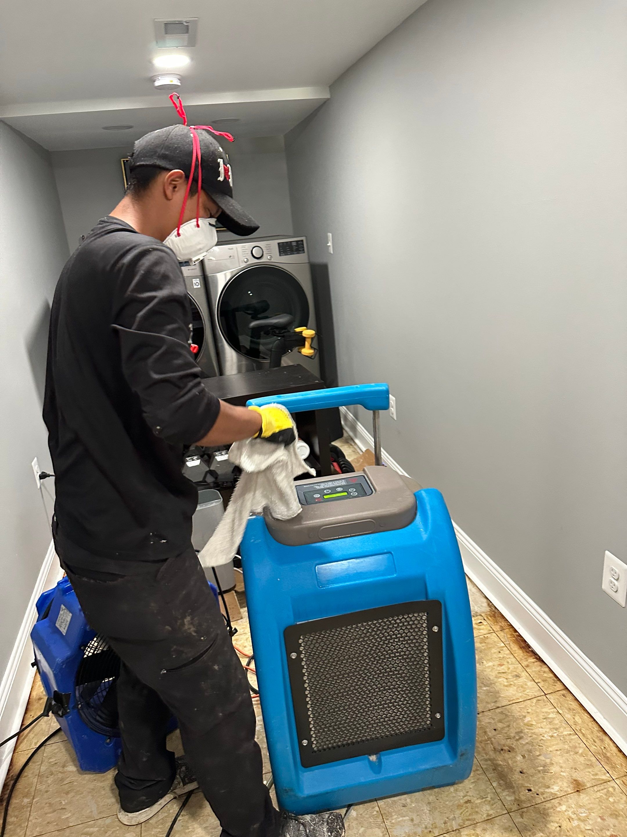 Mid-stage drying showing continued equipment deployment for structural moisture removal in Arlington.