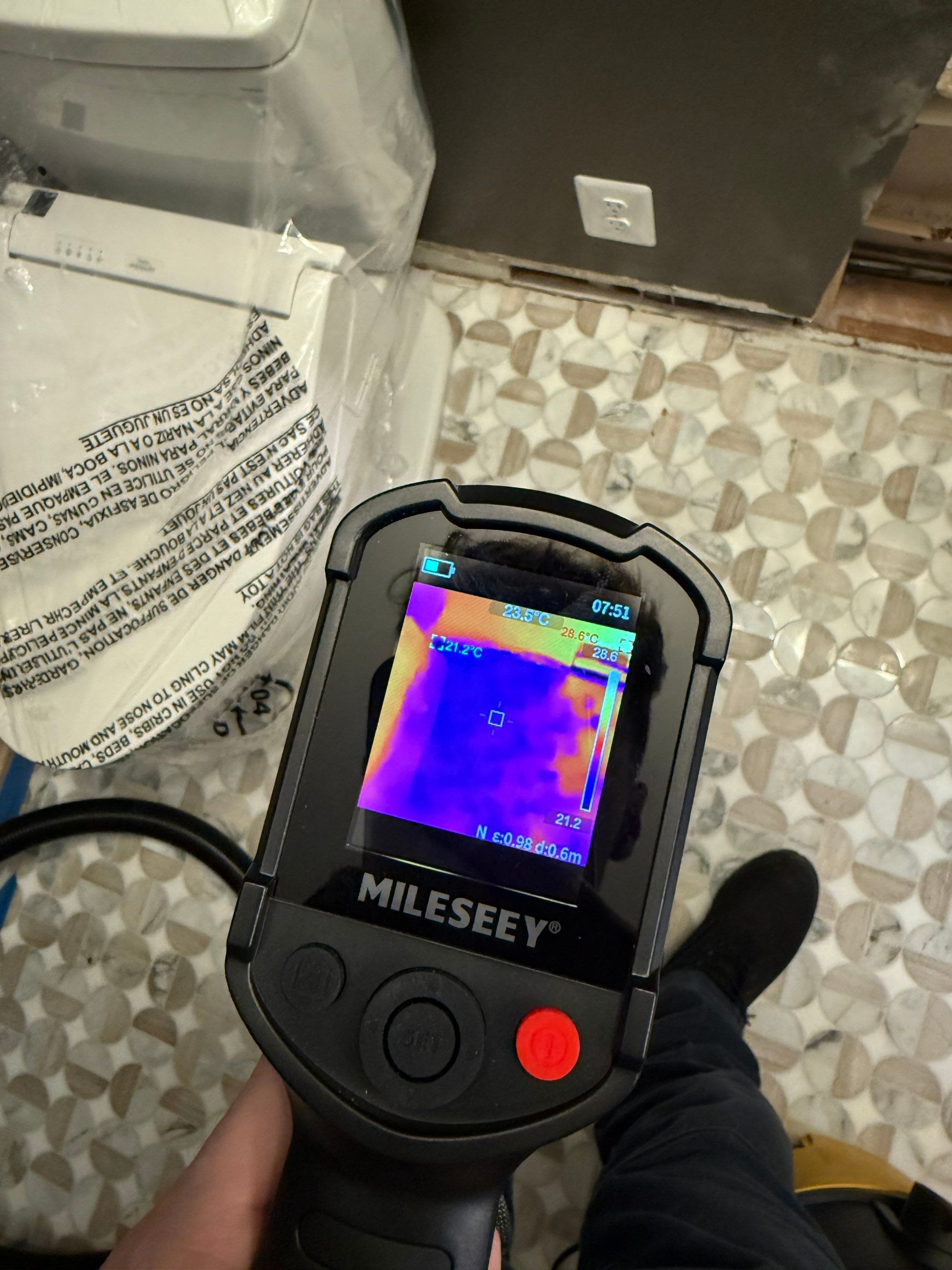 Carpet extraction and subfloor inspection underway as part of water damage restoration process.