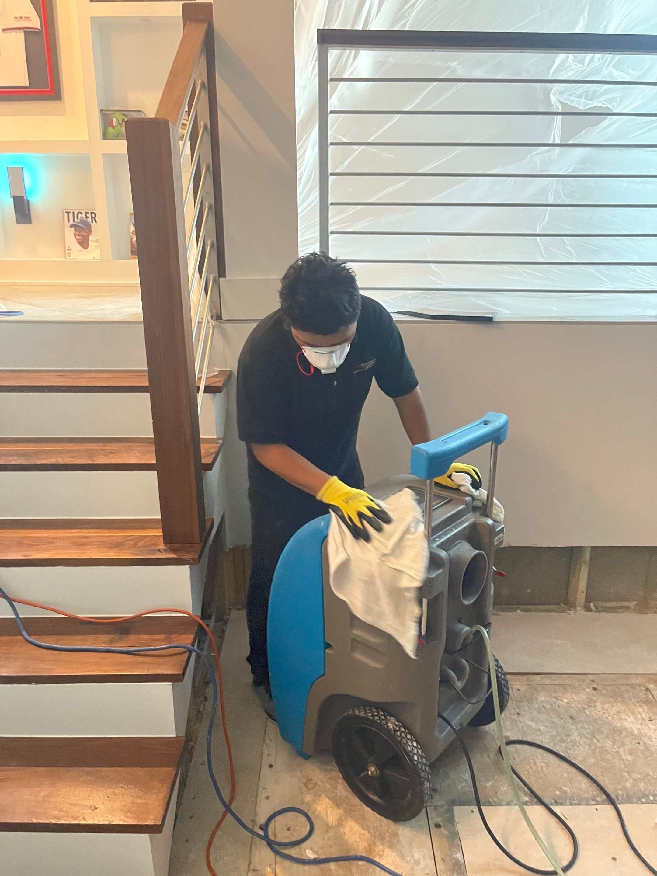 Moisture monitoring equipment deployed across affected areas of Arlington residence.