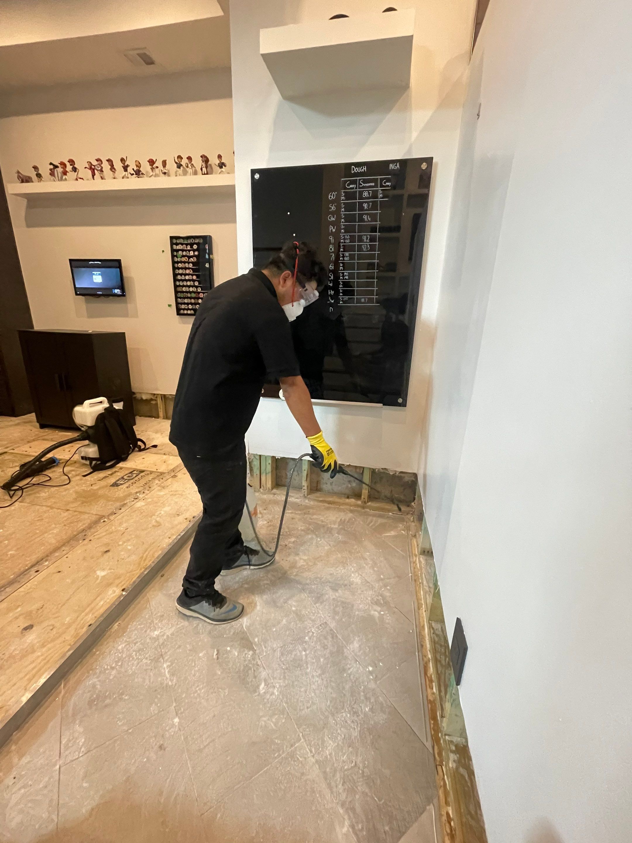Water-damaged carpet and flooring in Arlington home awaiting extraction and drying.
