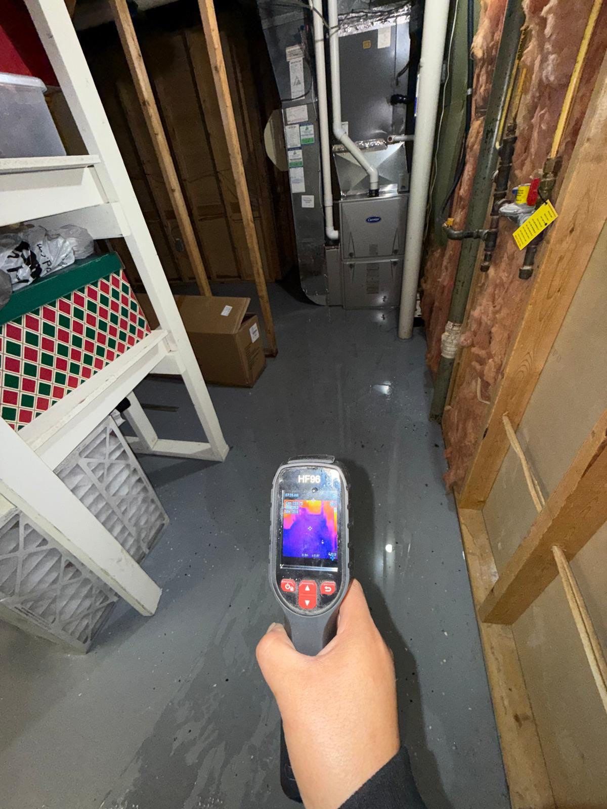 Dehumidifiers and air movers positioned for structural drying phase of water restoration.