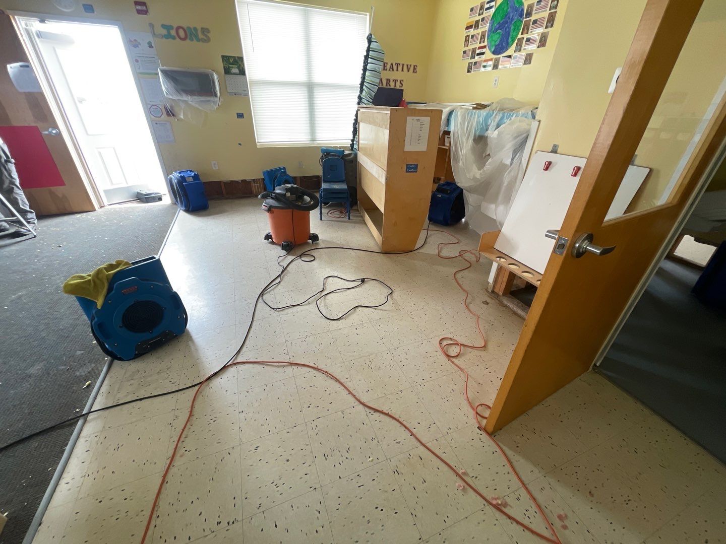 Dehumidification and sanitizing phase of water damage restoration in progress.