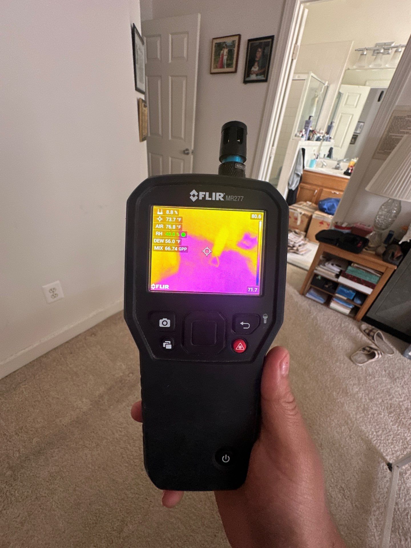 Mid-stage drying progress with continued moisture monitoring in Gainesville water damage restoration.