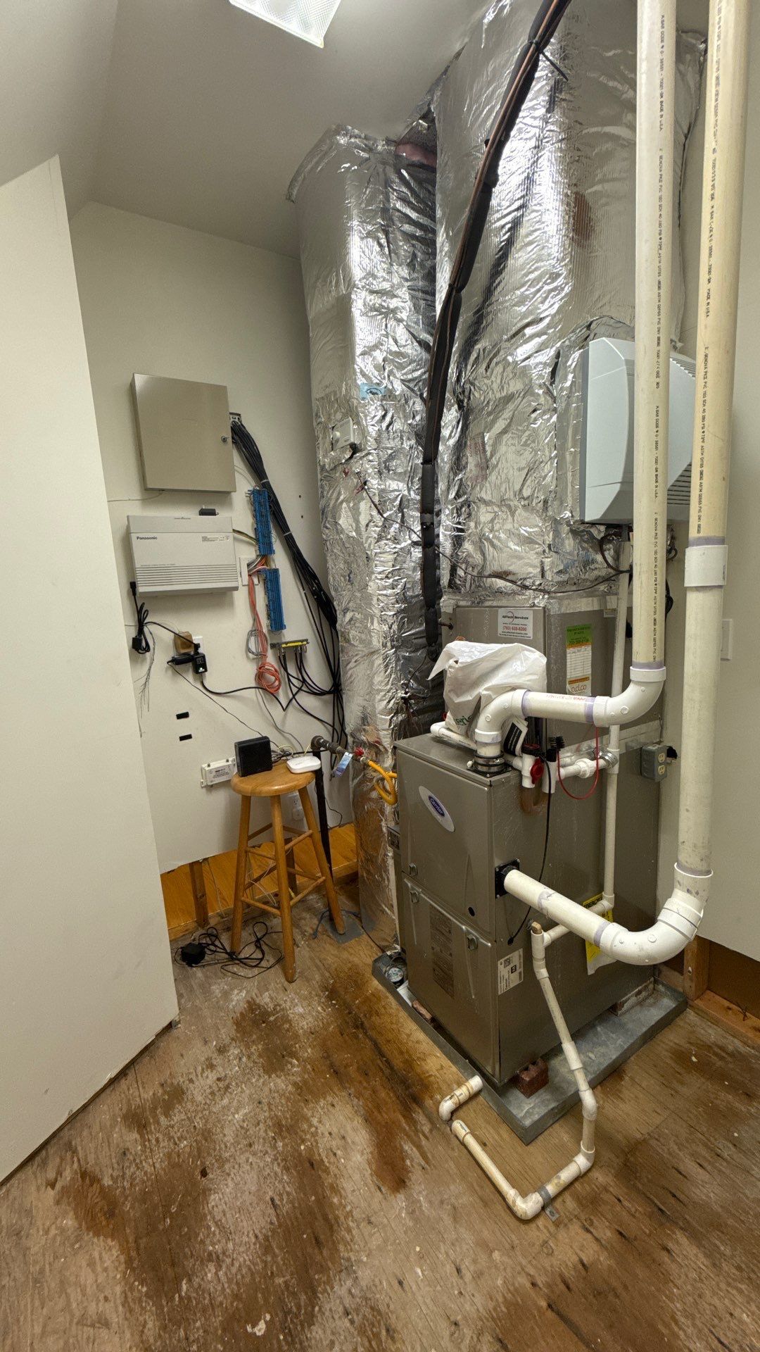 Structural drying equipment positioned within containment to remove moisture from affected framing and substrates.