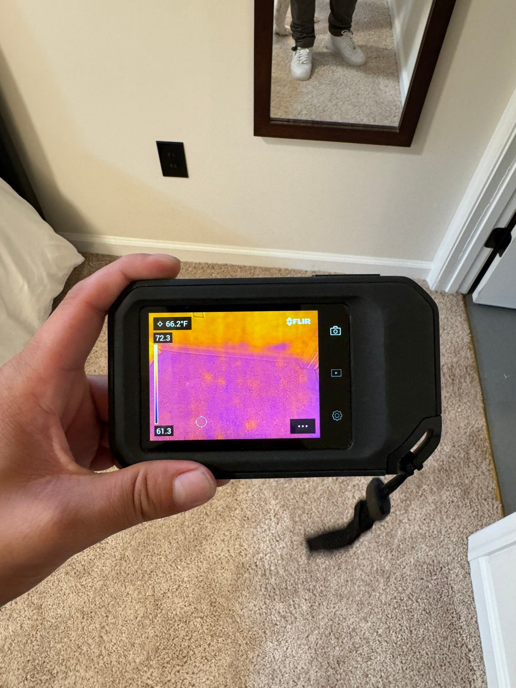 Thermal imaging camera documenting moisture distribution during water damage assessment in Woodbridge.