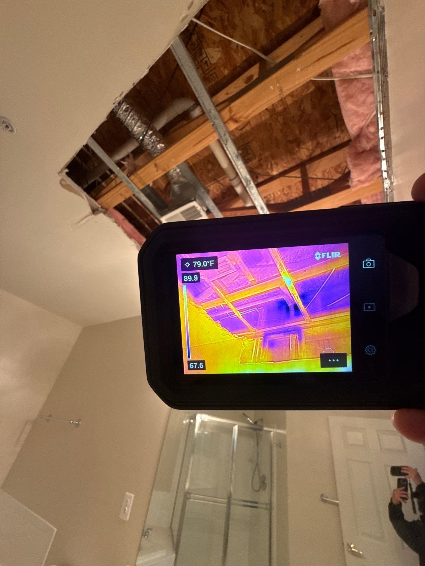 Containment and extraction phase showing saturated ceiling materials isolated for controlled removal.