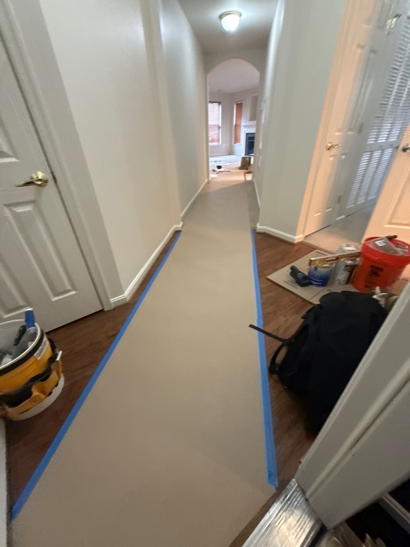 Structural drying setup with dehumidifiers and air movers positioned to manage moisture in ceiling cavity.