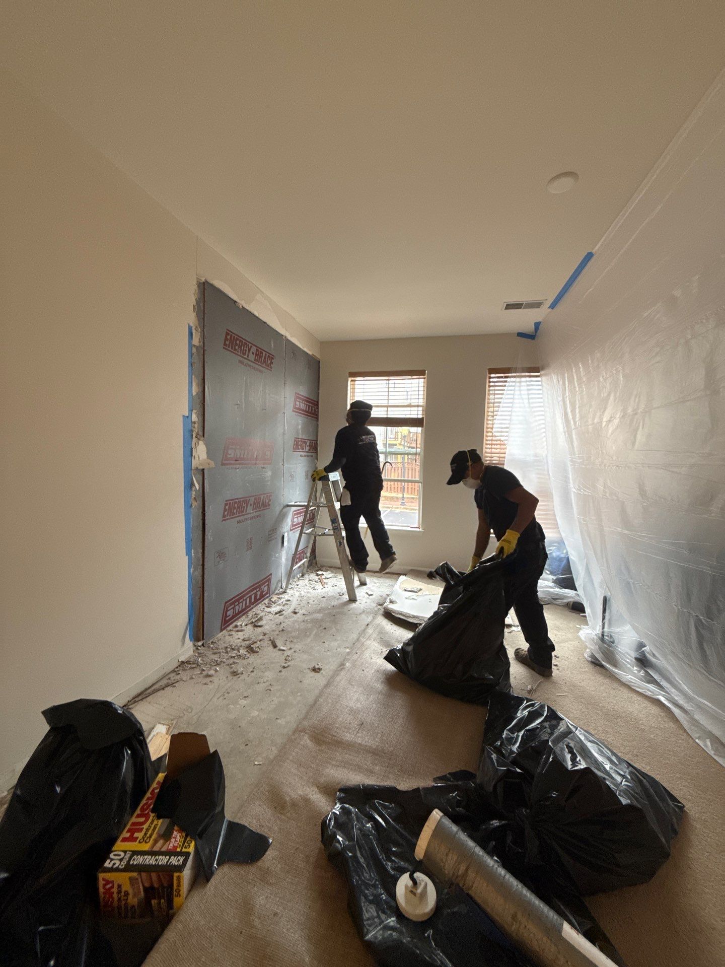 Drying equipment monitoring moisture levels in compromised ceiling structure during mold remediation.