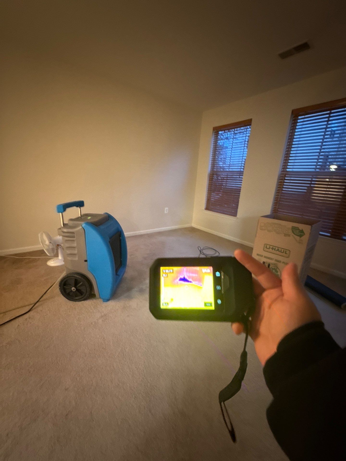 Standing water removal underway in Alexandria mold remediation, extractors deployed across affected floor.