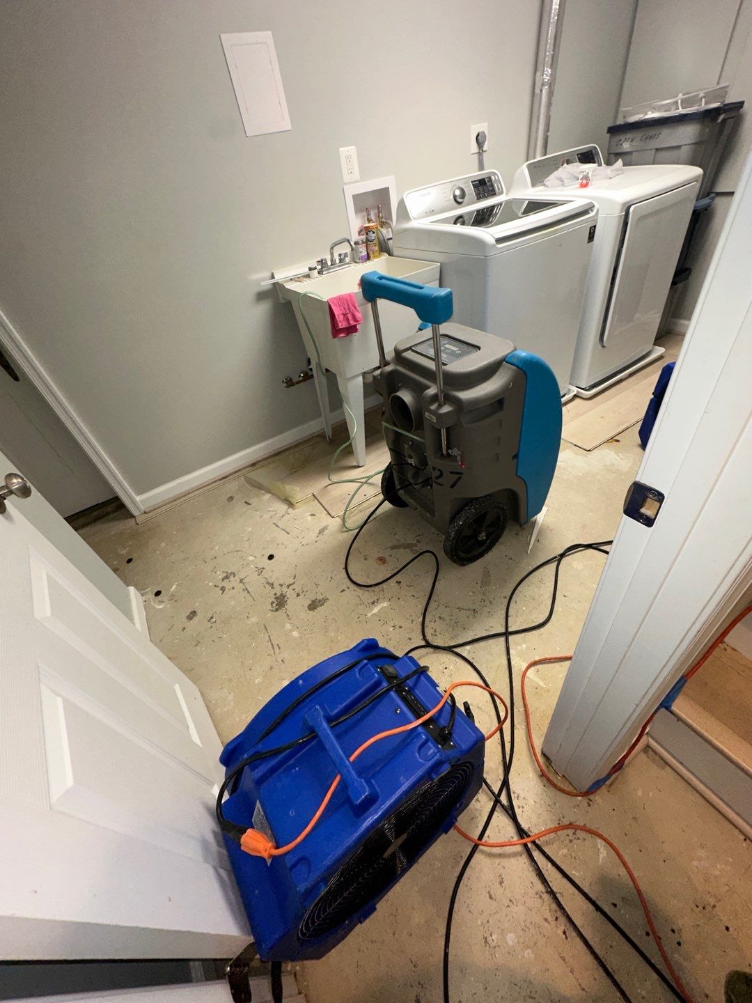 Continued drying operation with equipment monitoring moisture levels as structural materials progress toward equilibrium in Arlington restoration.