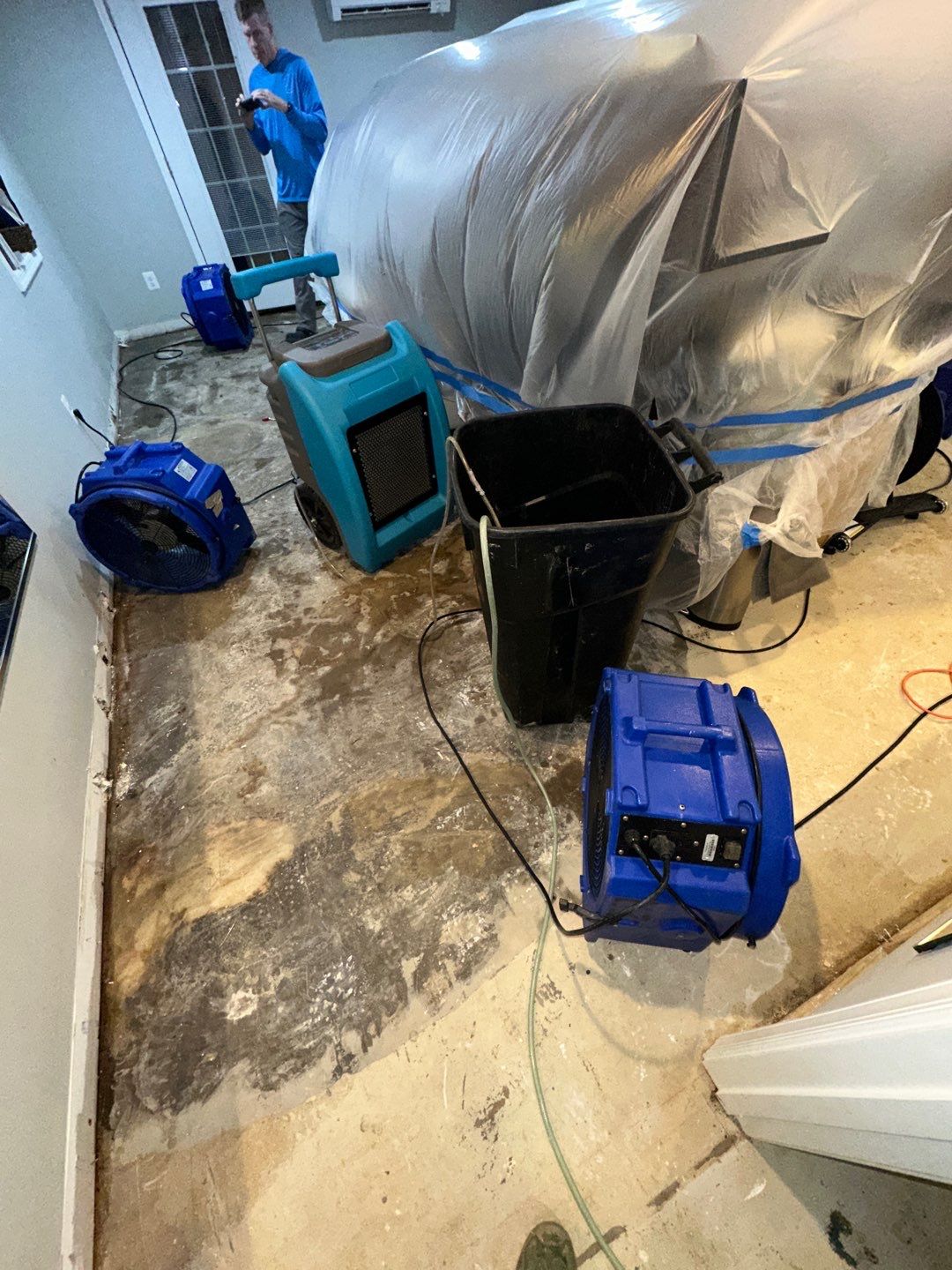 Dehumidification equipment positioned throughout affected area to manage moisture during structural drying phase of restoration.
