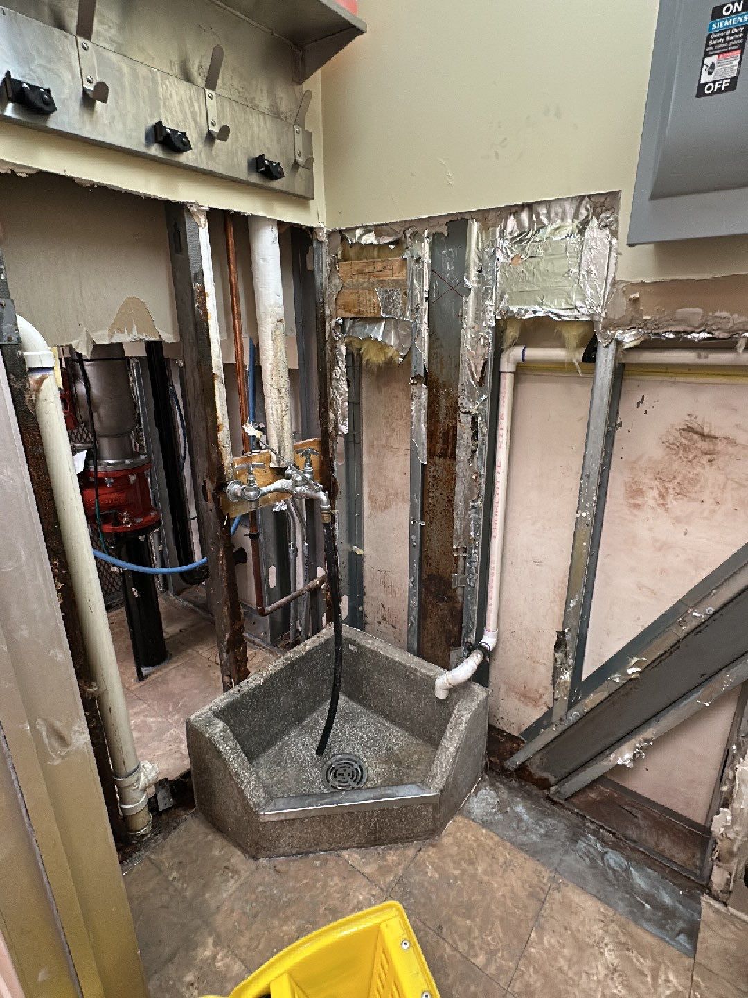 Wet carpet and flooring with active dehumidifier and containment barrier in place.