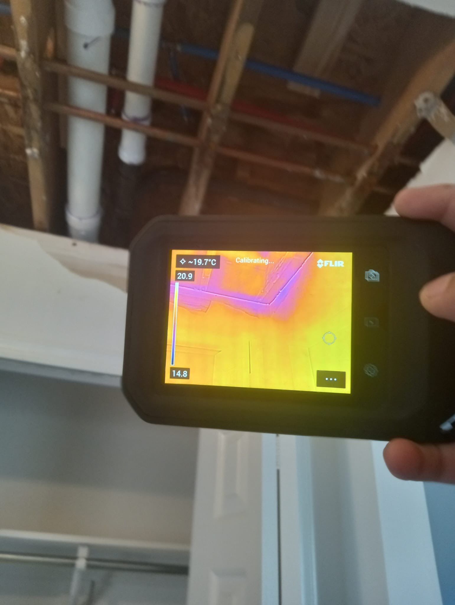 Wall cavity inspection and preparation during structural drying phase of restoration work.