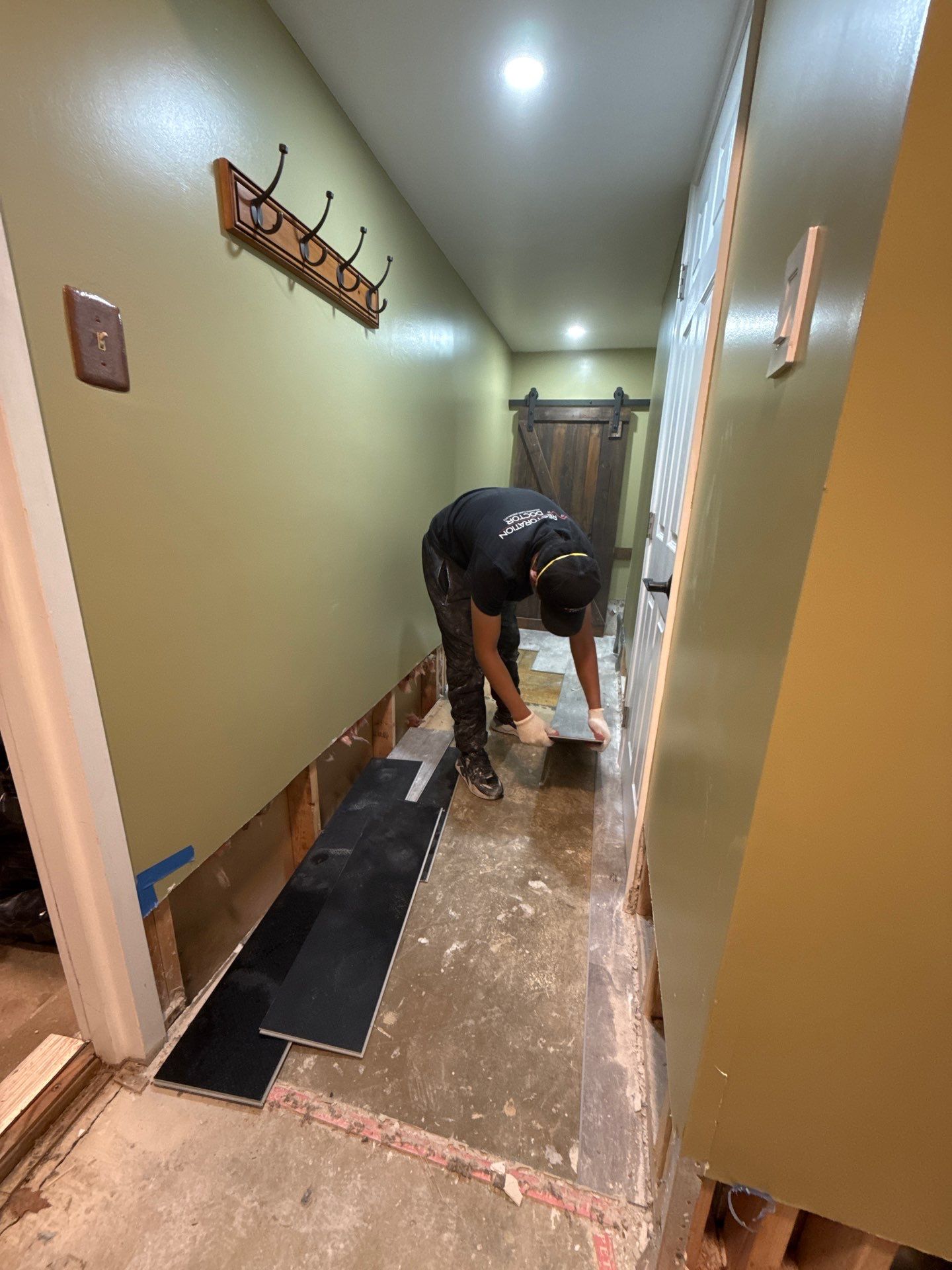 Flooring removal and preparation for replacement, exposing substrate for thorough drying and inspection.