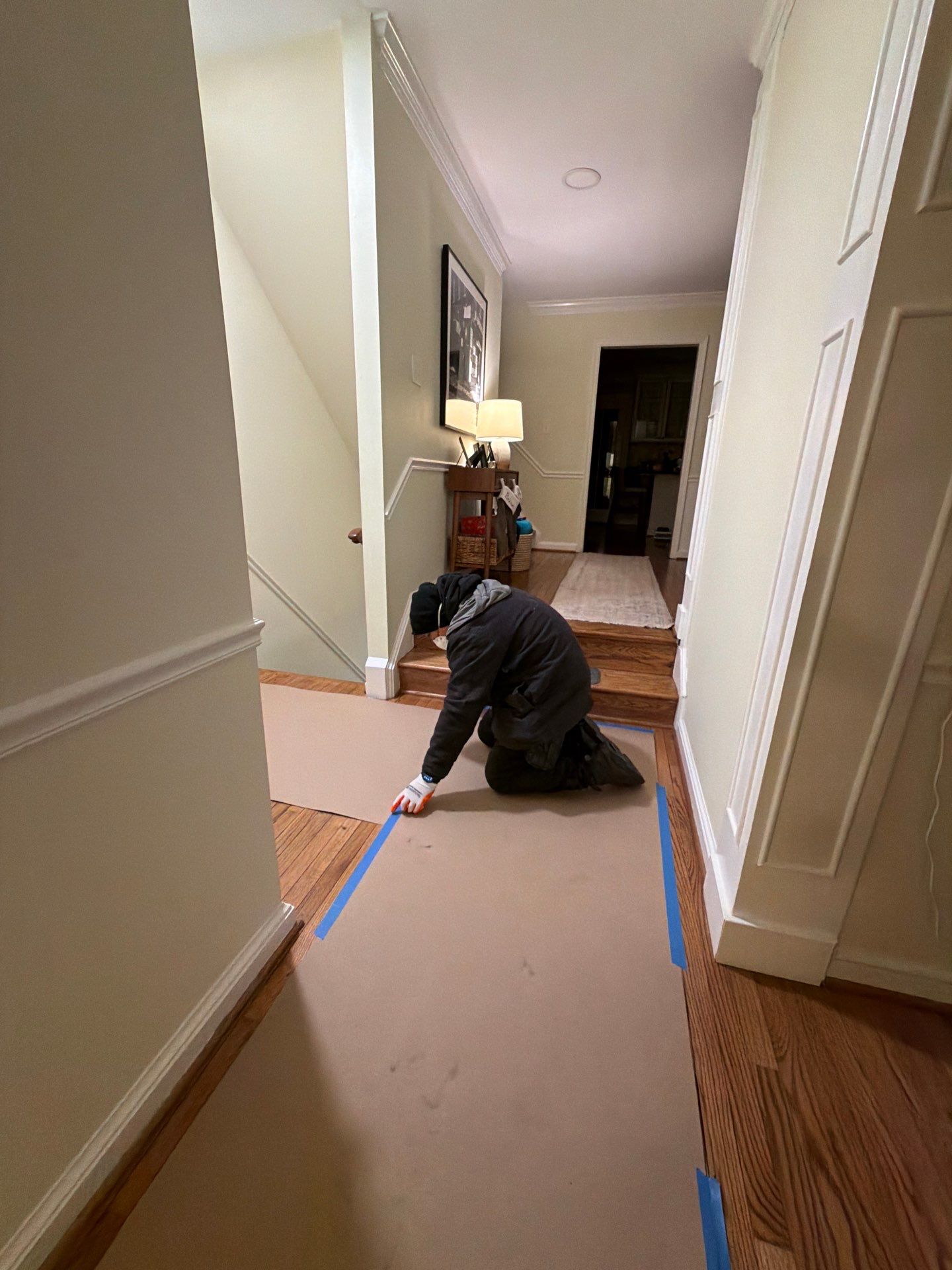 Standing water extraction underway in McLean water damage restoration, removal equipment deployed across affected flooring.
