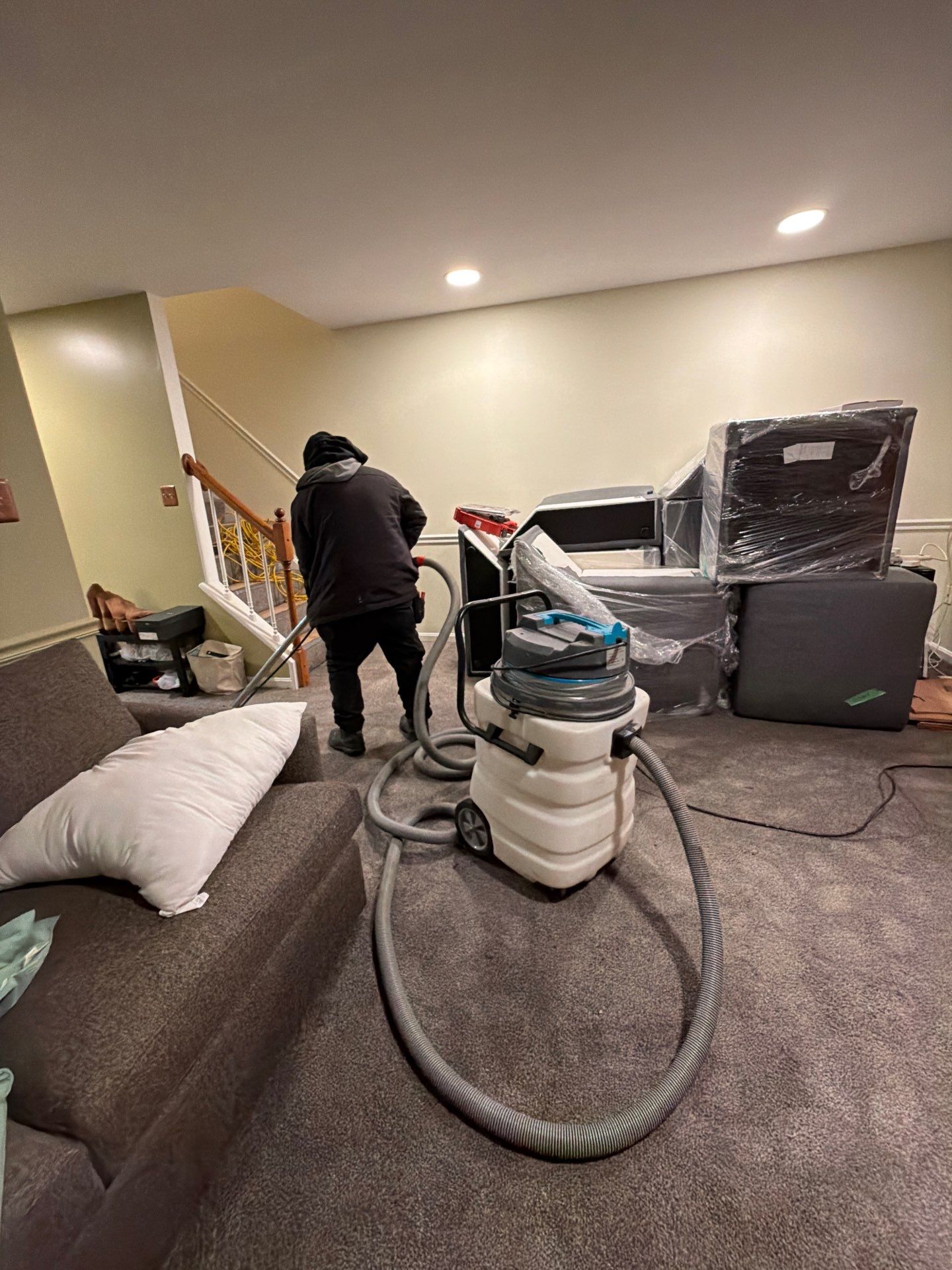 Structural drying phase with dehumidifiers and air movers positioned to manage moisture throughout the space.