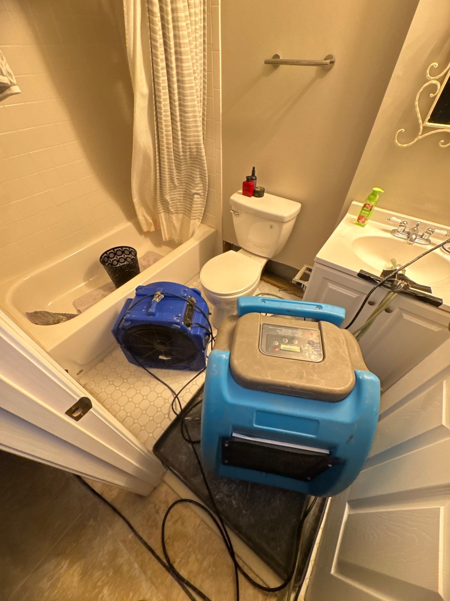 Standing water being extracted from flooring during water damage restoration in Oakton.
