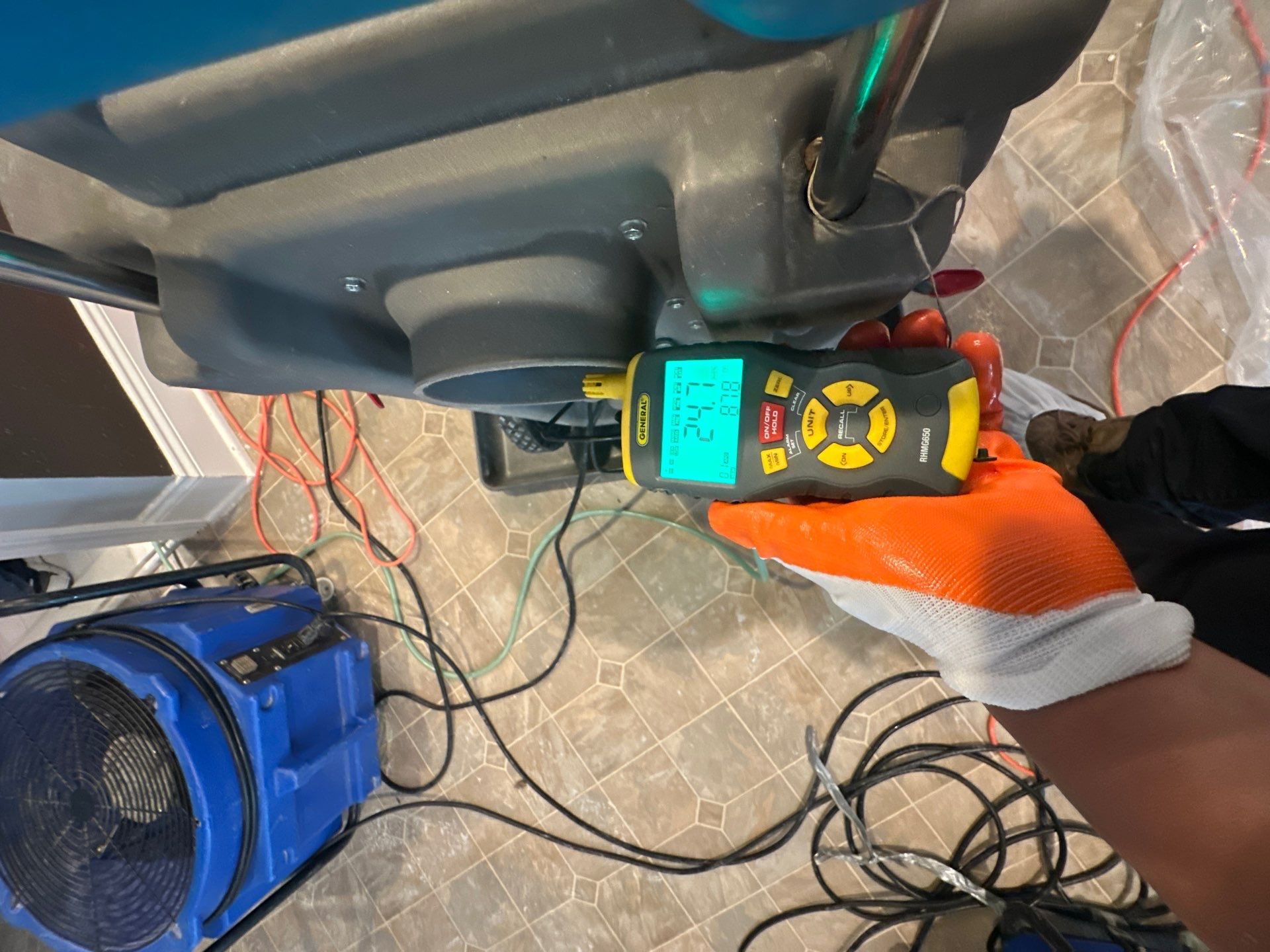 Structural drying in progress with dehumidification equipment positioned to manage moisture in ceiling cavity.