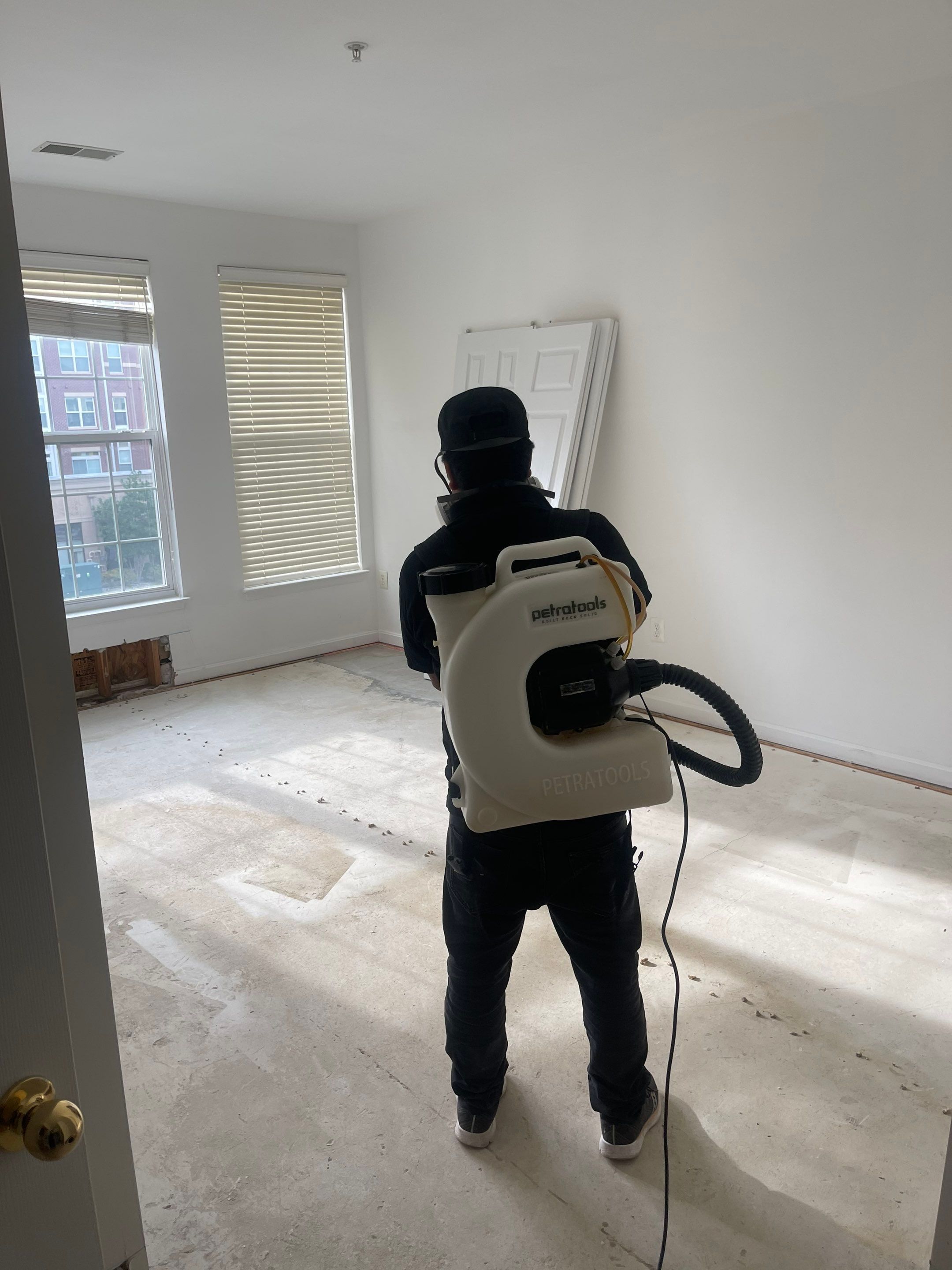 Water-damaged carpet and flooring in Vienna home with dehumidification equipment positioned for structural drying.