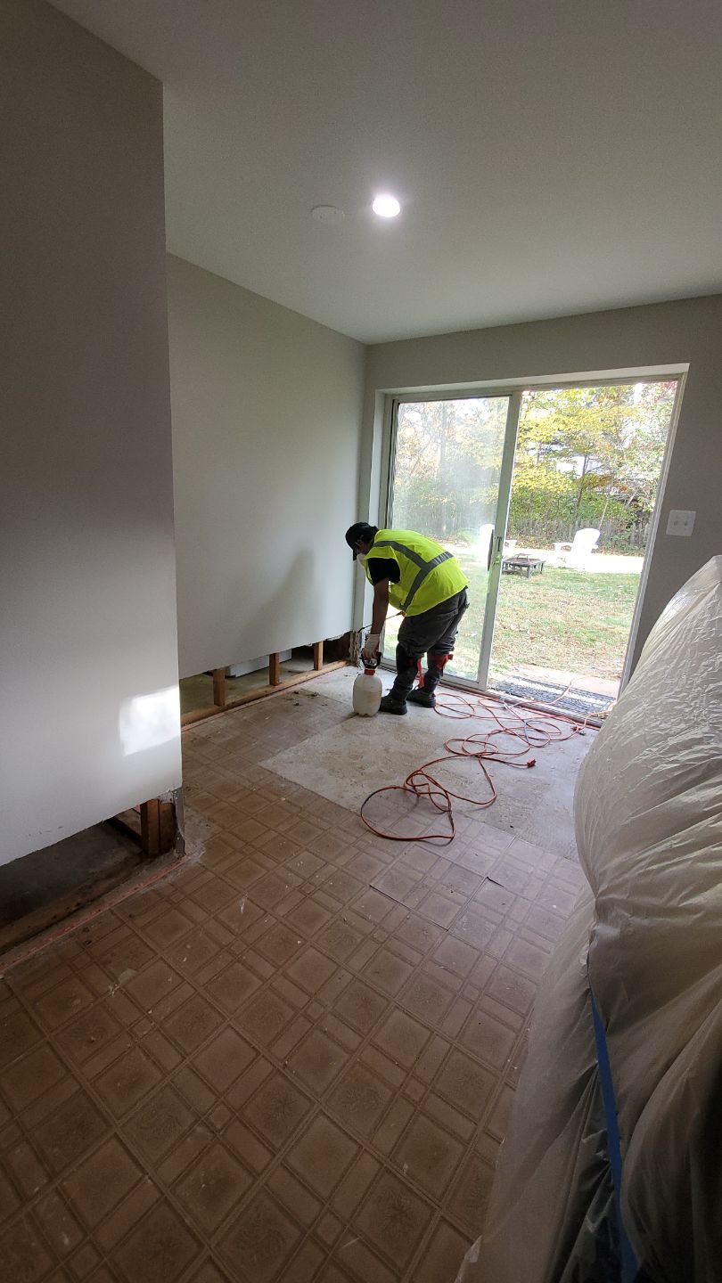 Mid-stage drying setup showing dehumidifier placement and containment integrity during Sterling water damage work.
