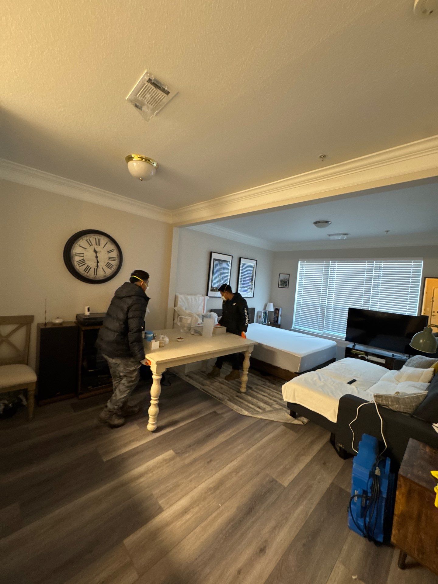 Sanitizing application to affected surfaces as part of mold remediation containment and remediation protocol.