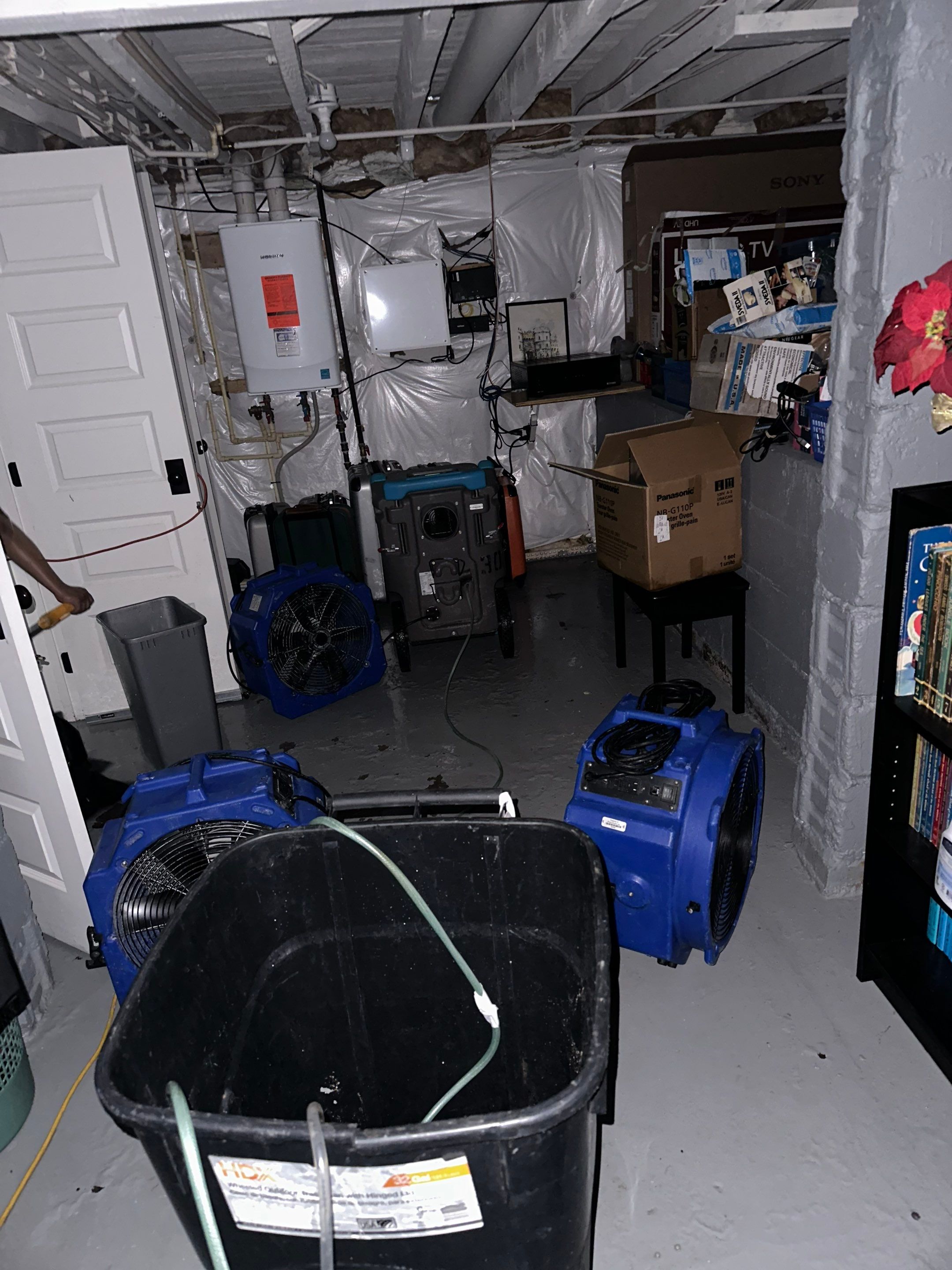 Dehumidification equipment positioned throughout affected space to manage moisture during structural drying phase.