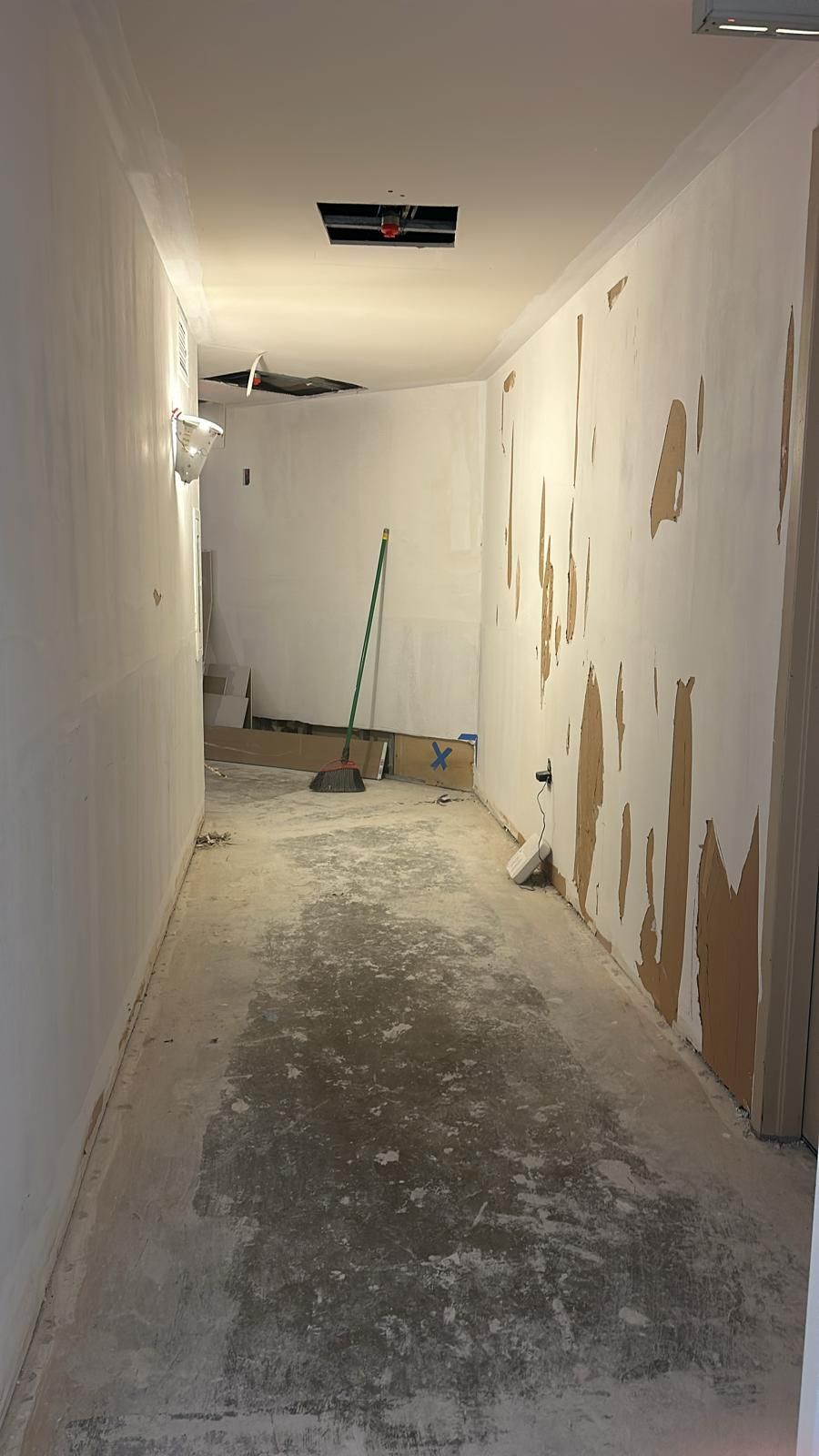 Flooring assessment during mold remediation work in Arlington.