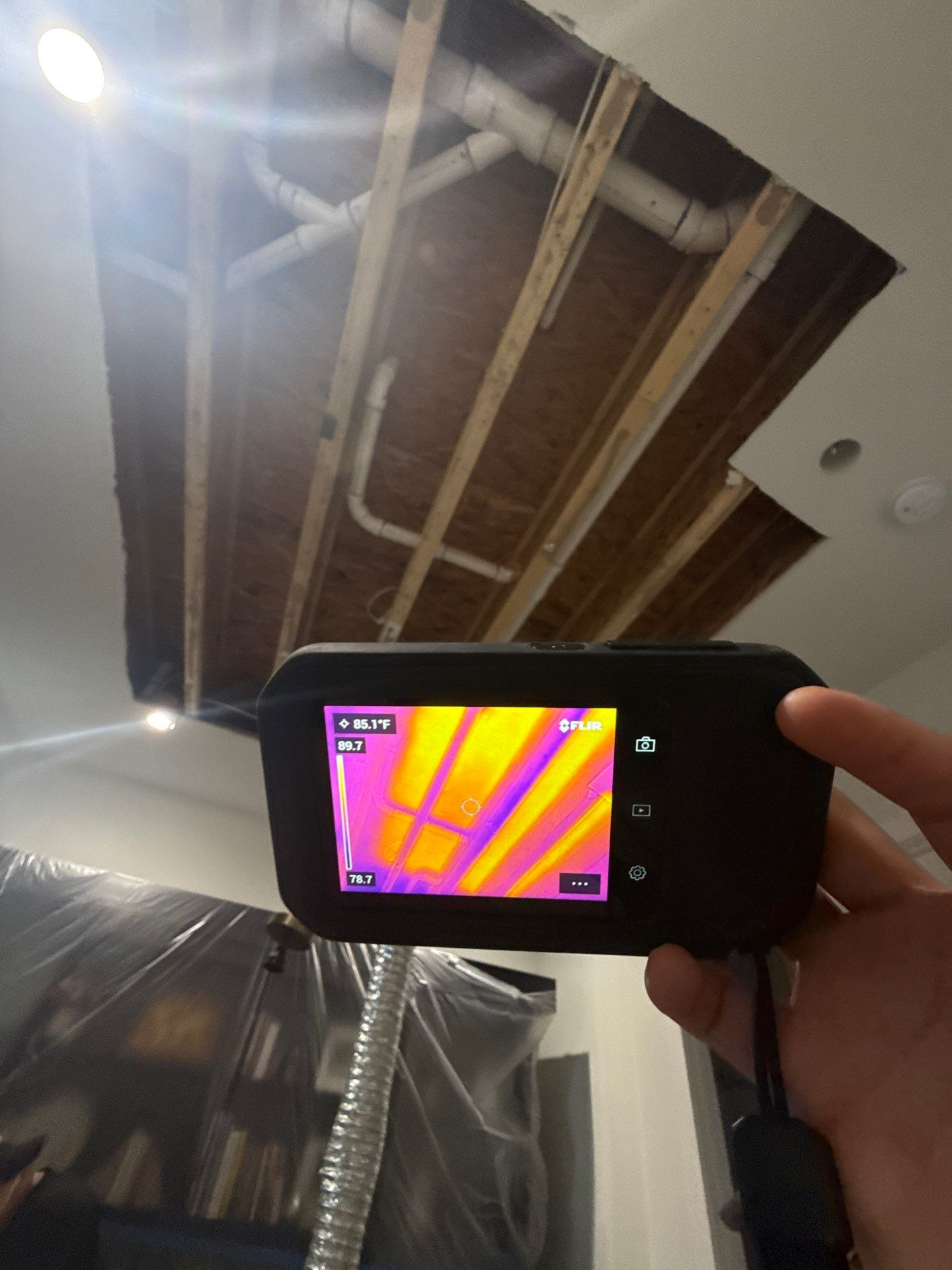 Water damage in Church, VA with wet ceiling and structural exposure requiring drying equipment setup.