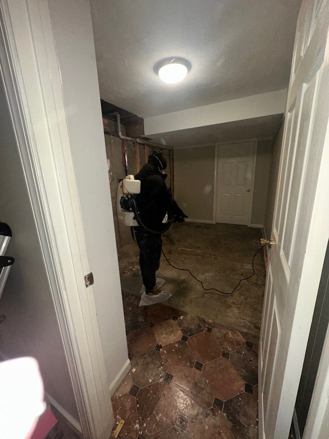 Water damage restoration underway in Oakton with dehumidifiers and air movers positioned for structural drying.