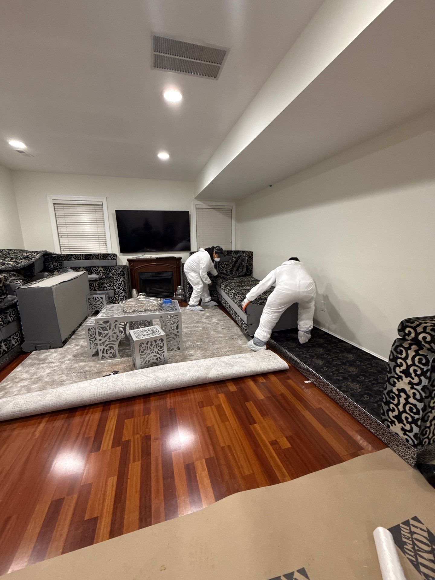 Flooring removal and moisture extraction phase of Vienna water damage remediation.