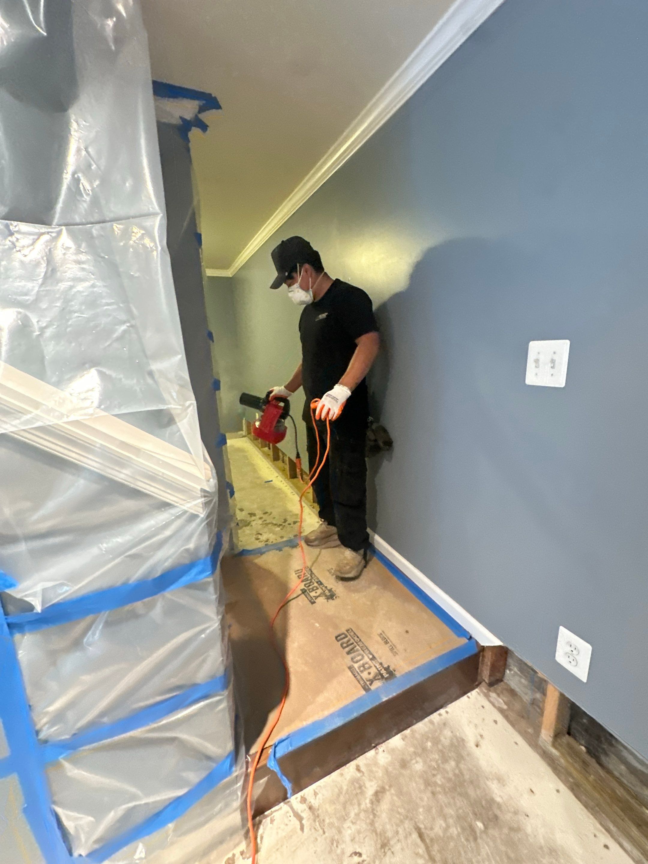 Continued dehumidification and structural drying process with equipment monitoring moisture levels in flooring.