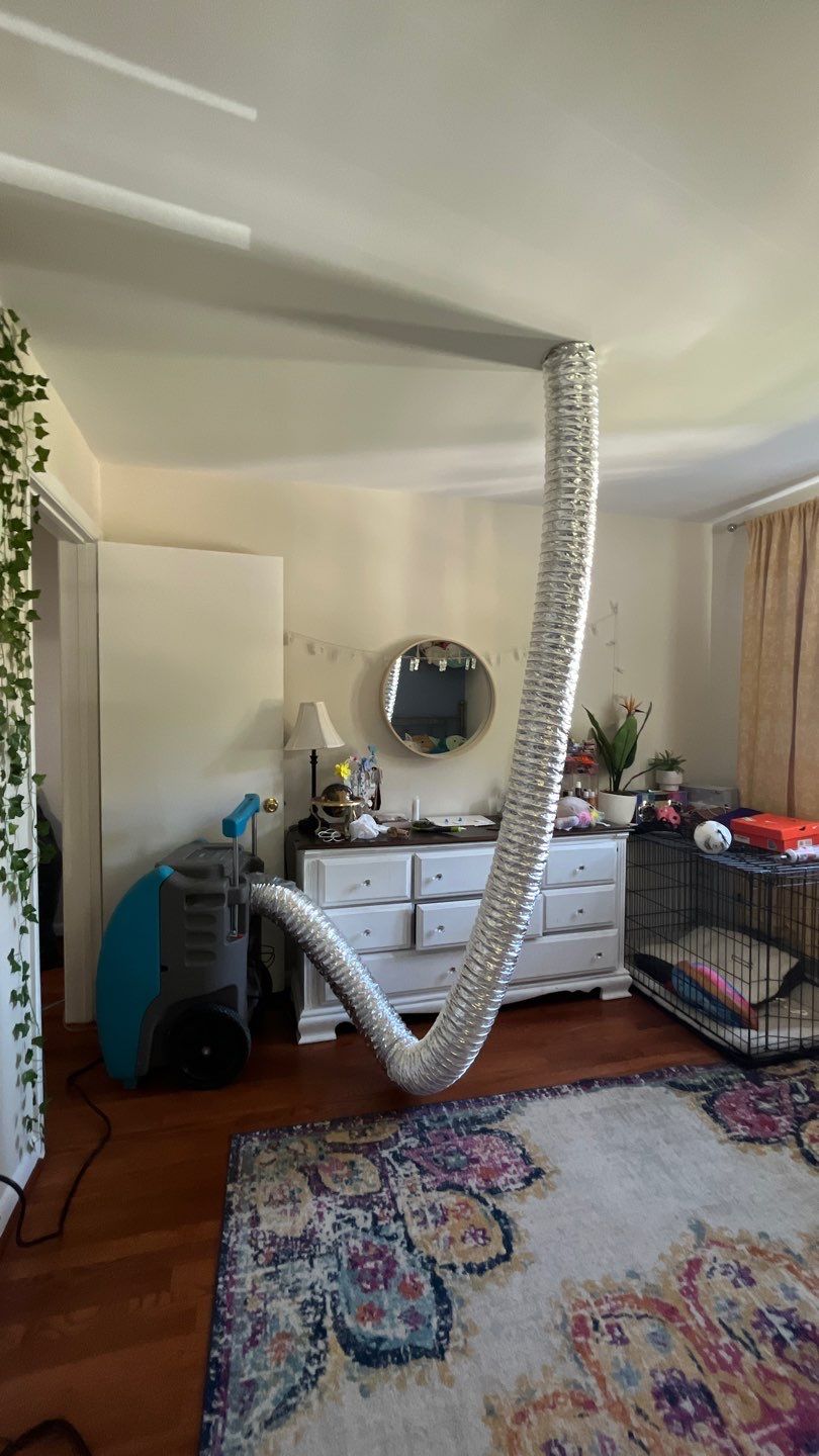 Final stages of water damage restoration in McLean with dehumidification complete and ceiling repair finished.